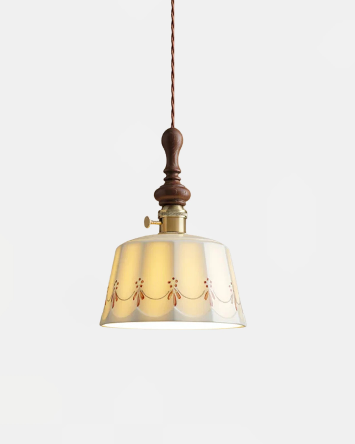 Ceramic pendant light MILA No.01 porcelain corolla shade with floral trim, walnut crown, lit on white