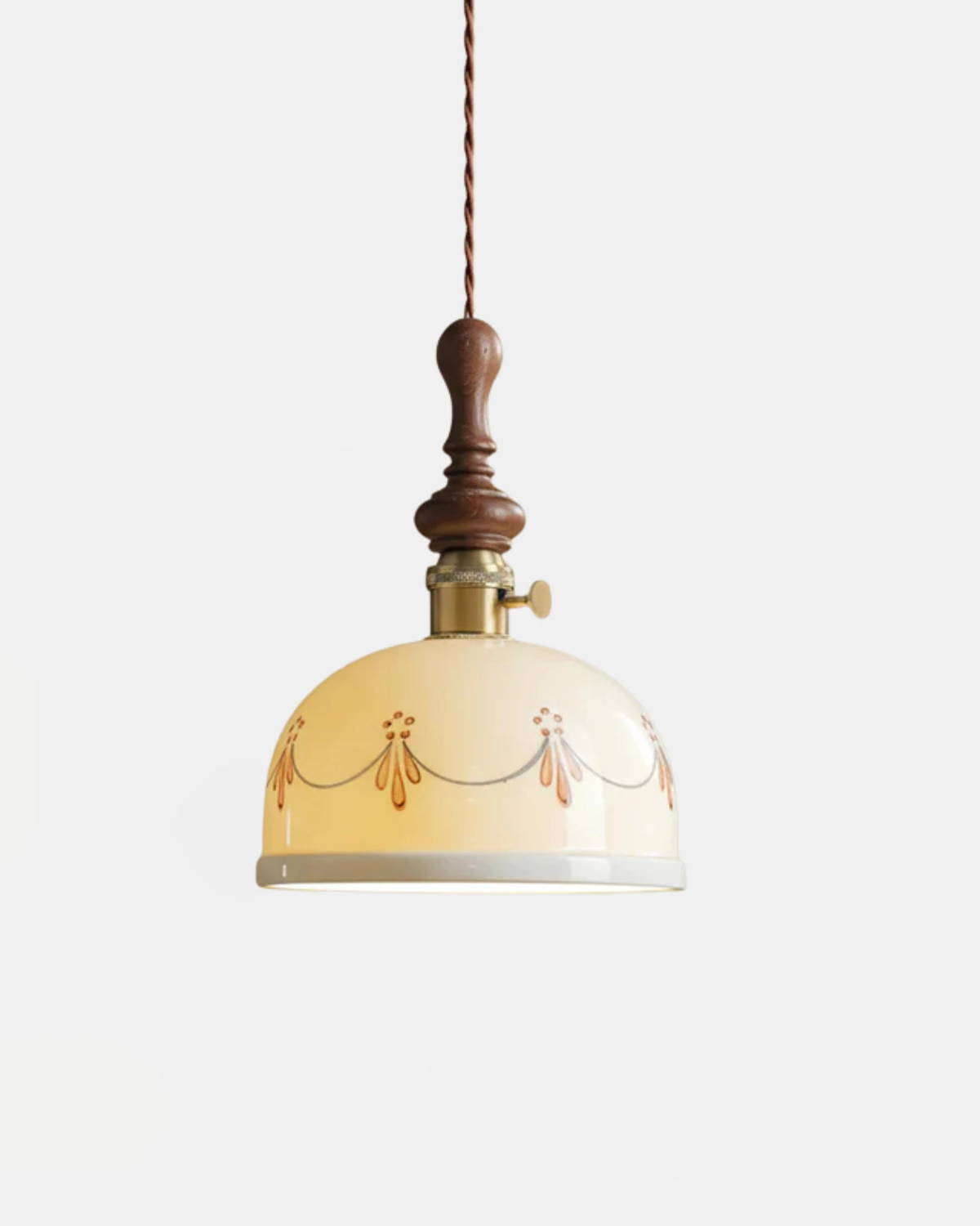 Ceramic pendant light MILA No.01 porcelain dome with painted garland, walnut crown and brass switch, switched on