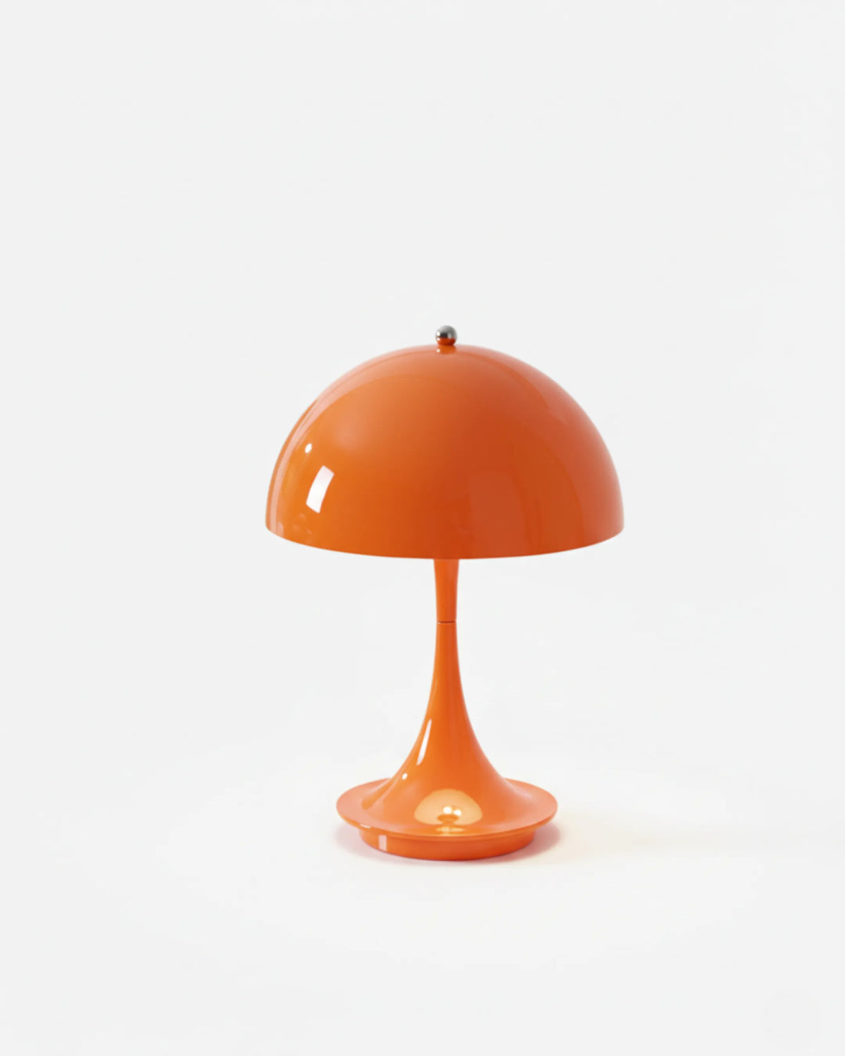 Cordless mushroom lamp FONTE No.01 in sun orange, glossy dome lit on a white background