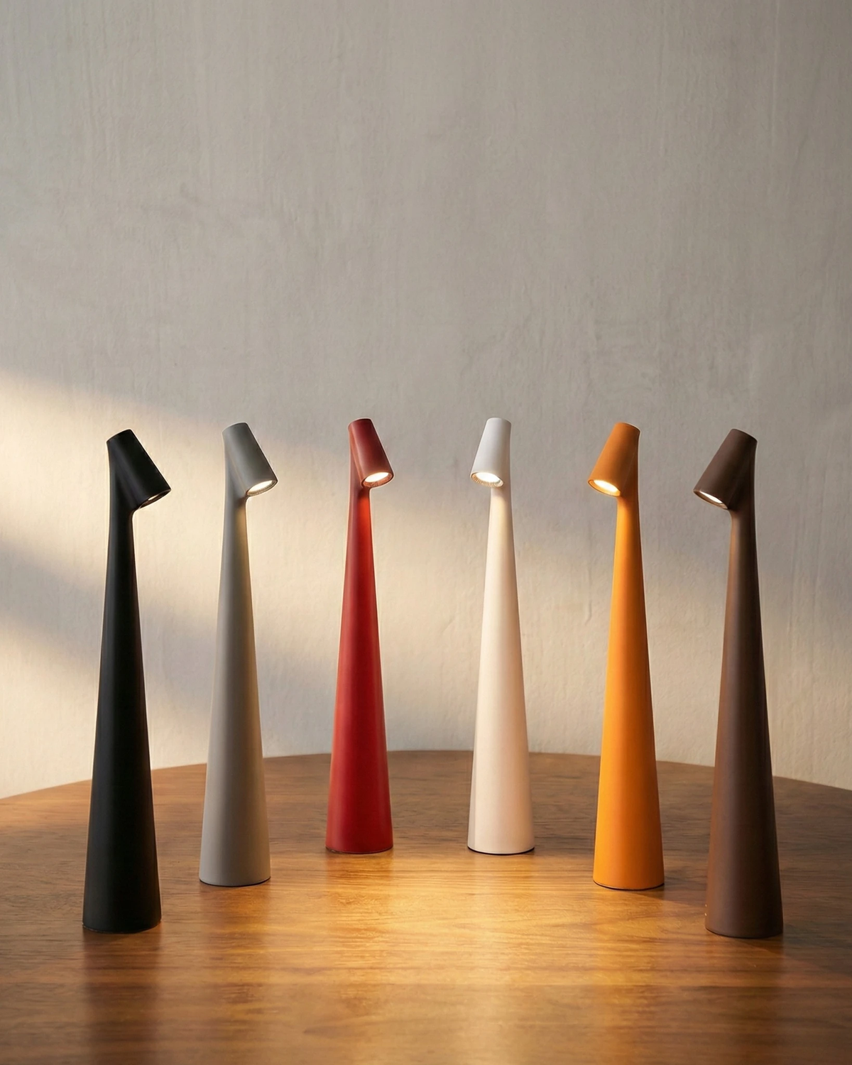 Set of six cordless reading lamps TRIESTE No.01 in black, grey, red, white, orange and brown, all switched on