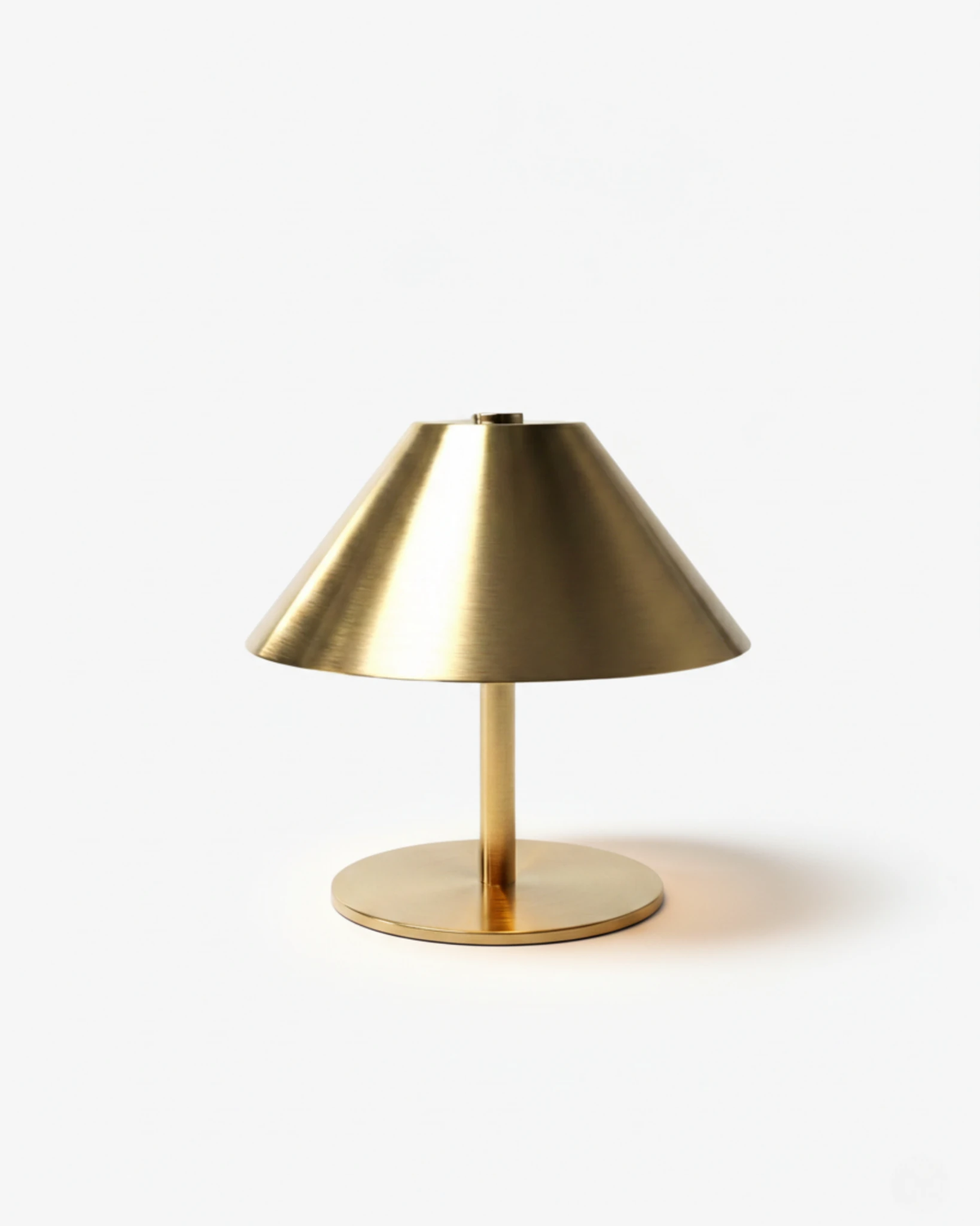 Cordless table lamp LUMA No.03 in brushed brass, cone shade on a thin stem with a flat round base, unlit