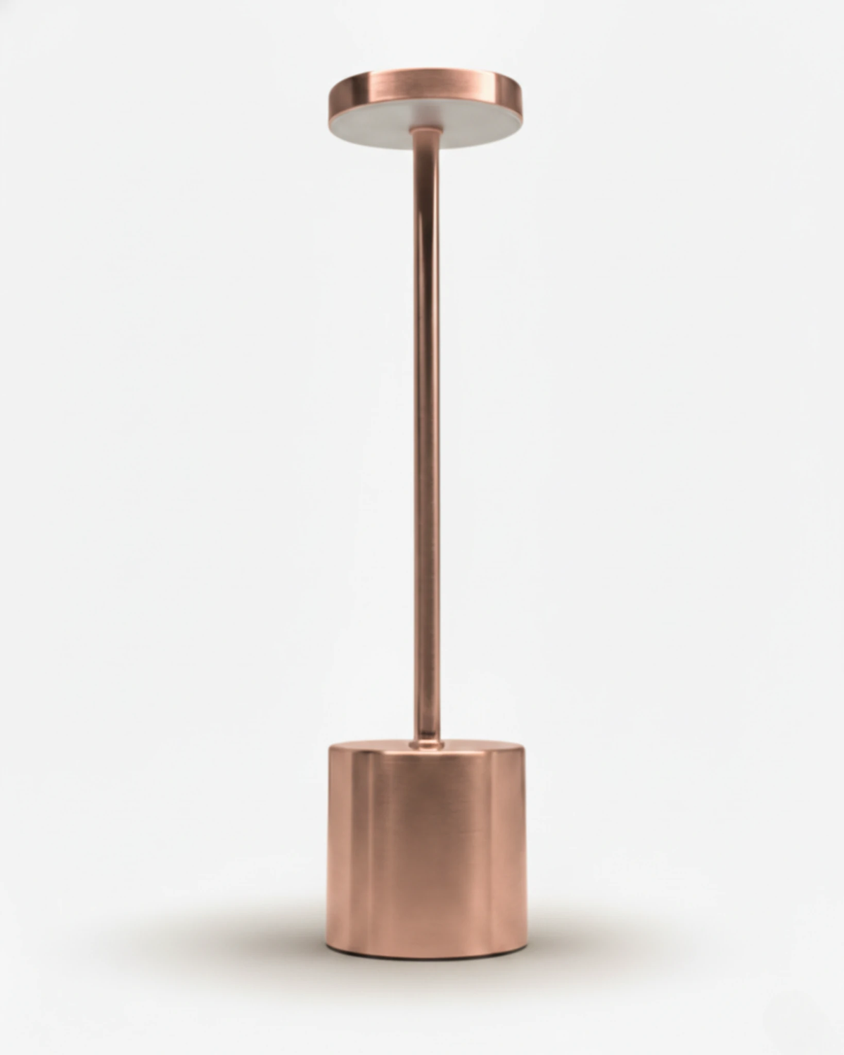 Cordless table lamp RIETI No.01 in brushed rose gold, minimal column with disc head and round base, unlit