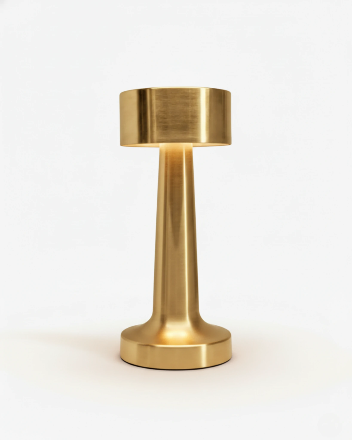 Cordless table lamp ISOLA No.01 in gold, brushed metal dumbbell shape with a wide flat head, unlit