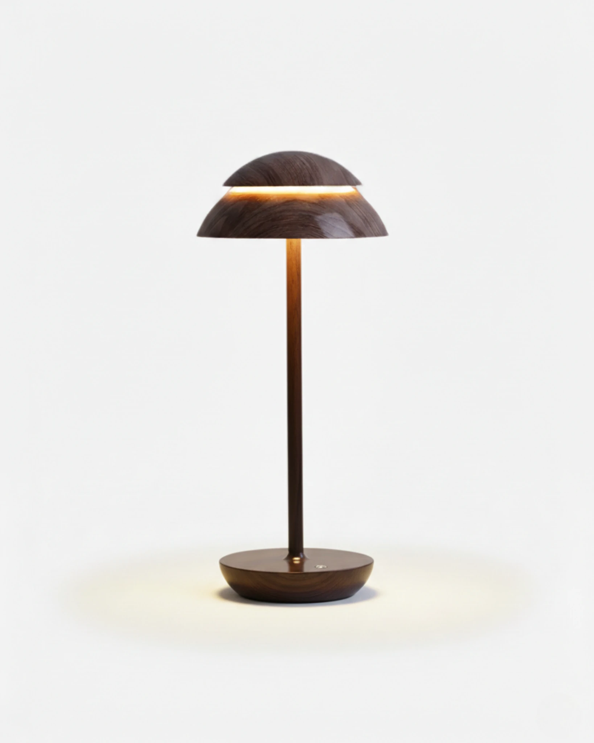 Cordless table lamp CALMA No.01 in Dark Wood, wood-grain dome cap glowing above a dark wood disc base