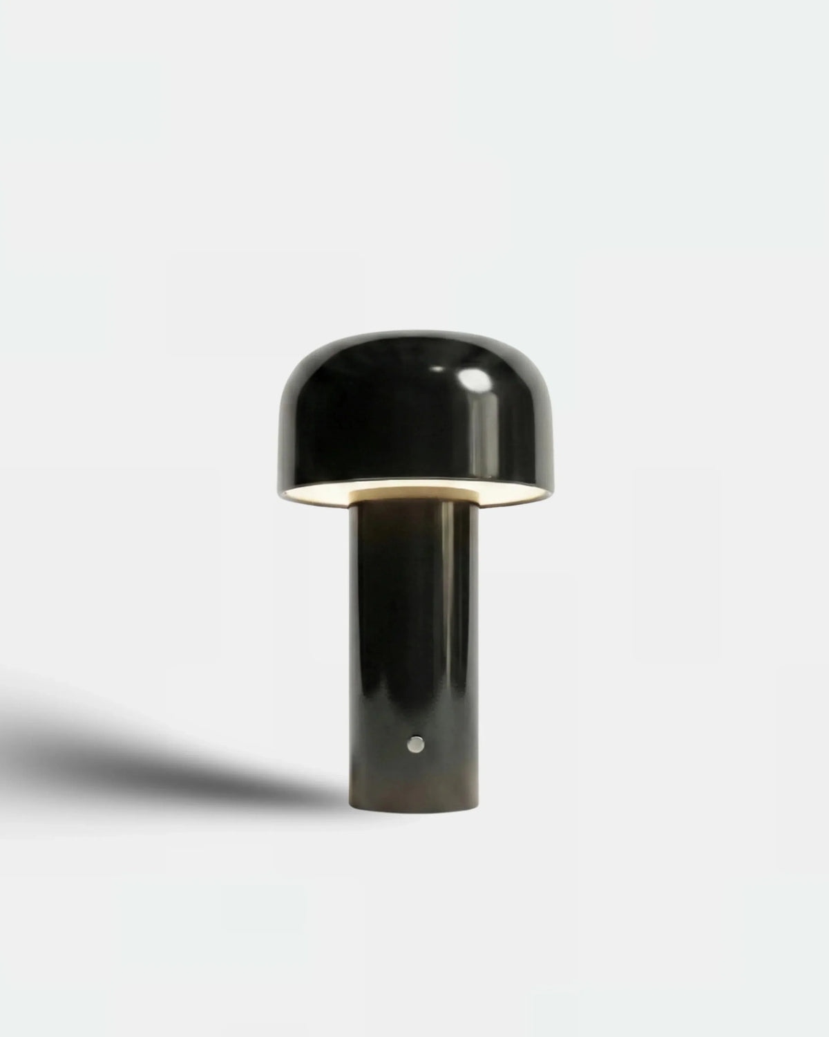 Cordless table lamp DOLCE No.01 in glossy deep black, mini flower-bud shape with the head switched on