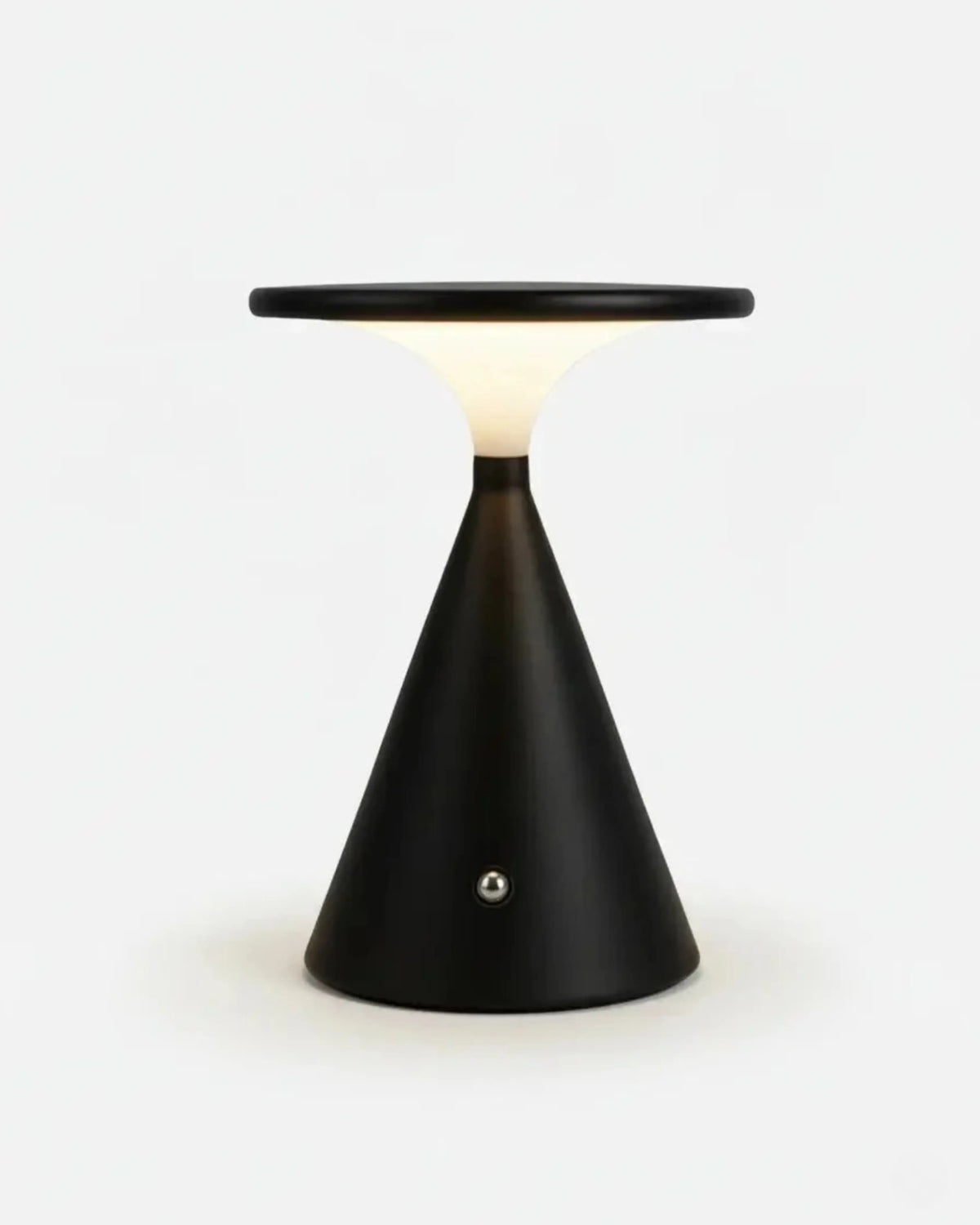 Cordless table lamp SOSTA No.01 in Matte Black, aluminum cone base with a flat disc plate switched on