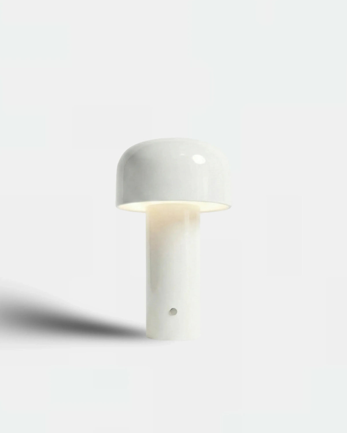 Cordless table lamp DOLCE No.01 in off-white, small flower-bud lamp lit on a white background
