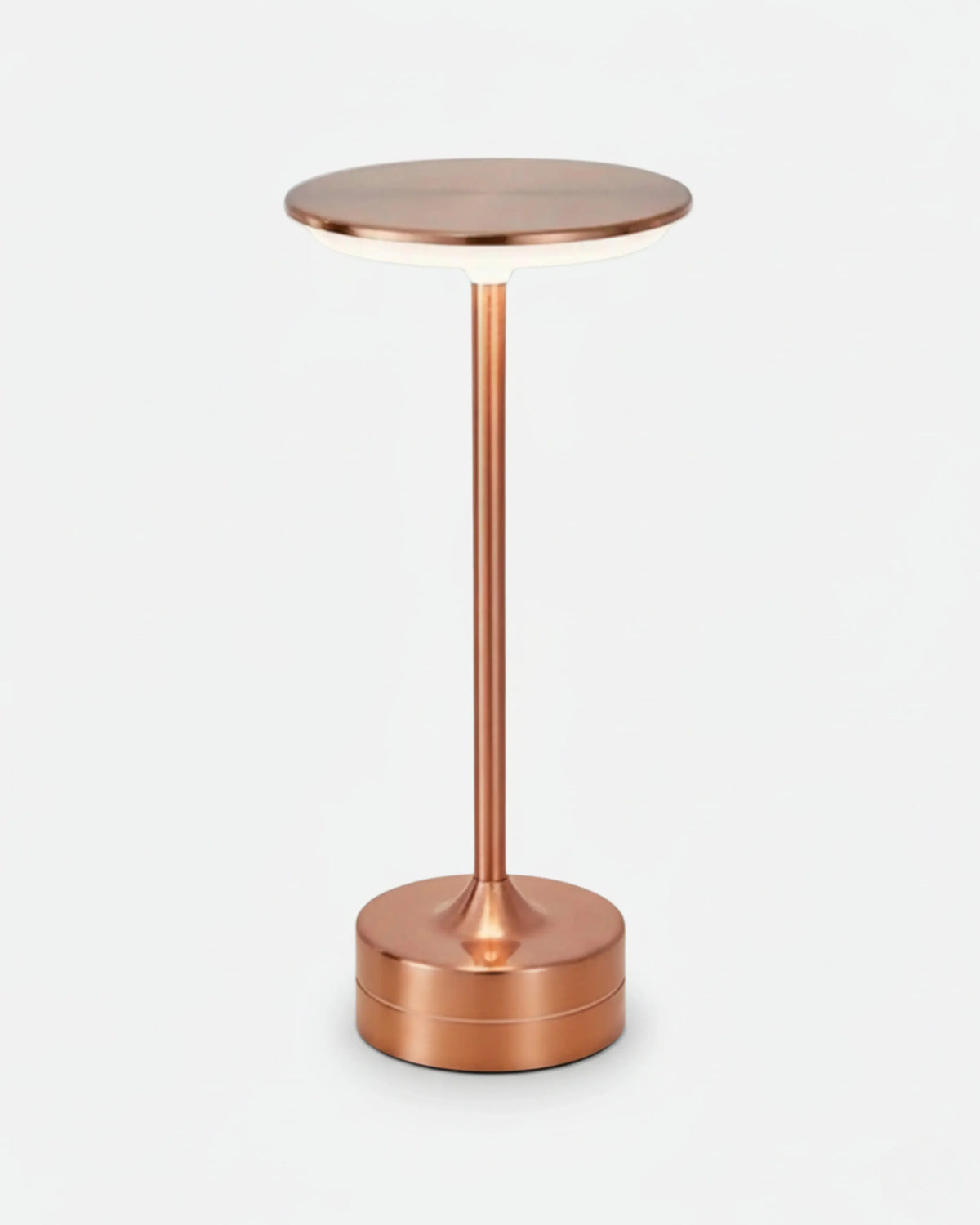 Cordless table lamp BRINDISI No.01 in Soft Pink, polished copper-toned disc top lit on a slender pedestal