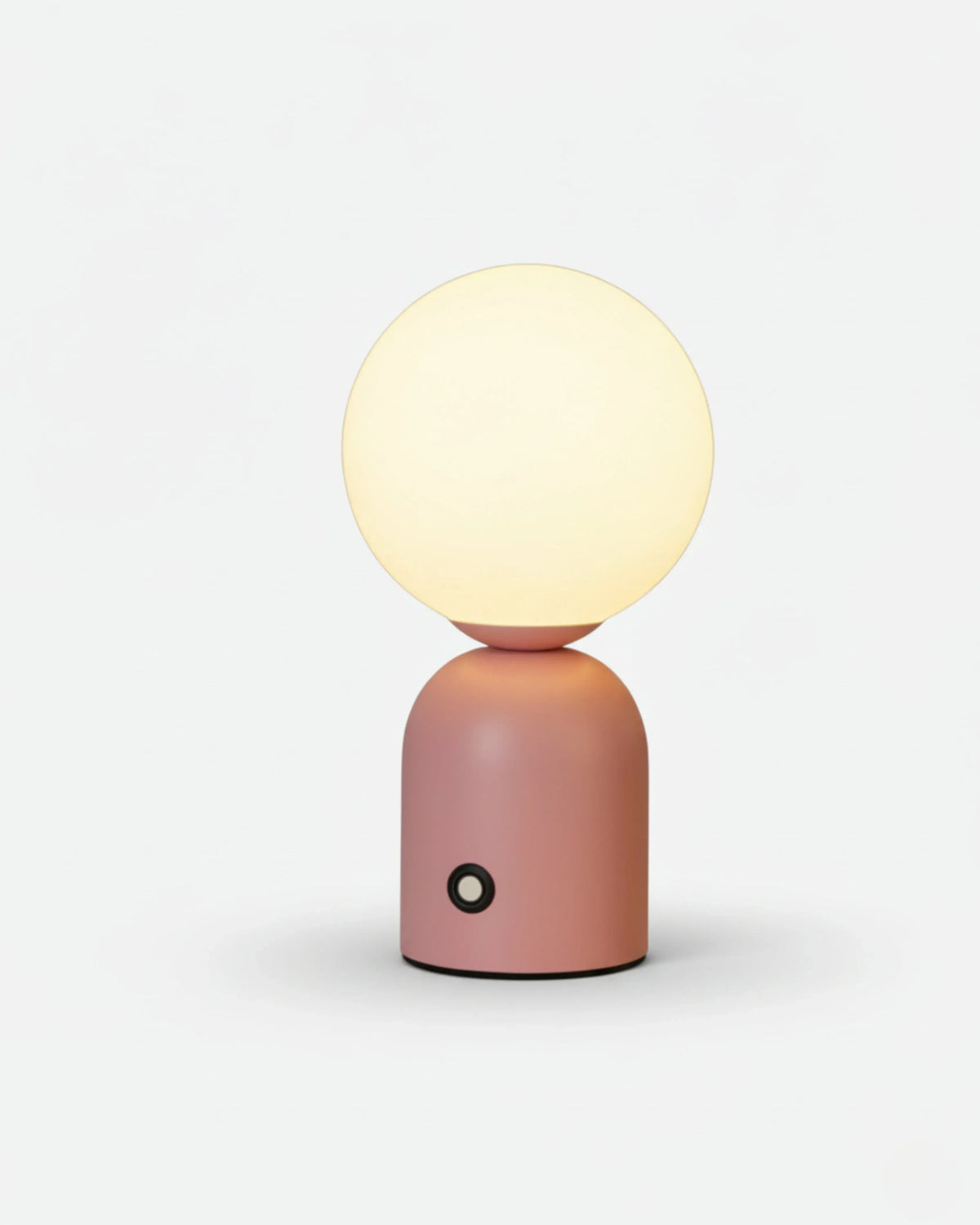 Cordless table lamp VIVA No.01 in Soft Pink, illuminated white globe on a blush pink lacquered base