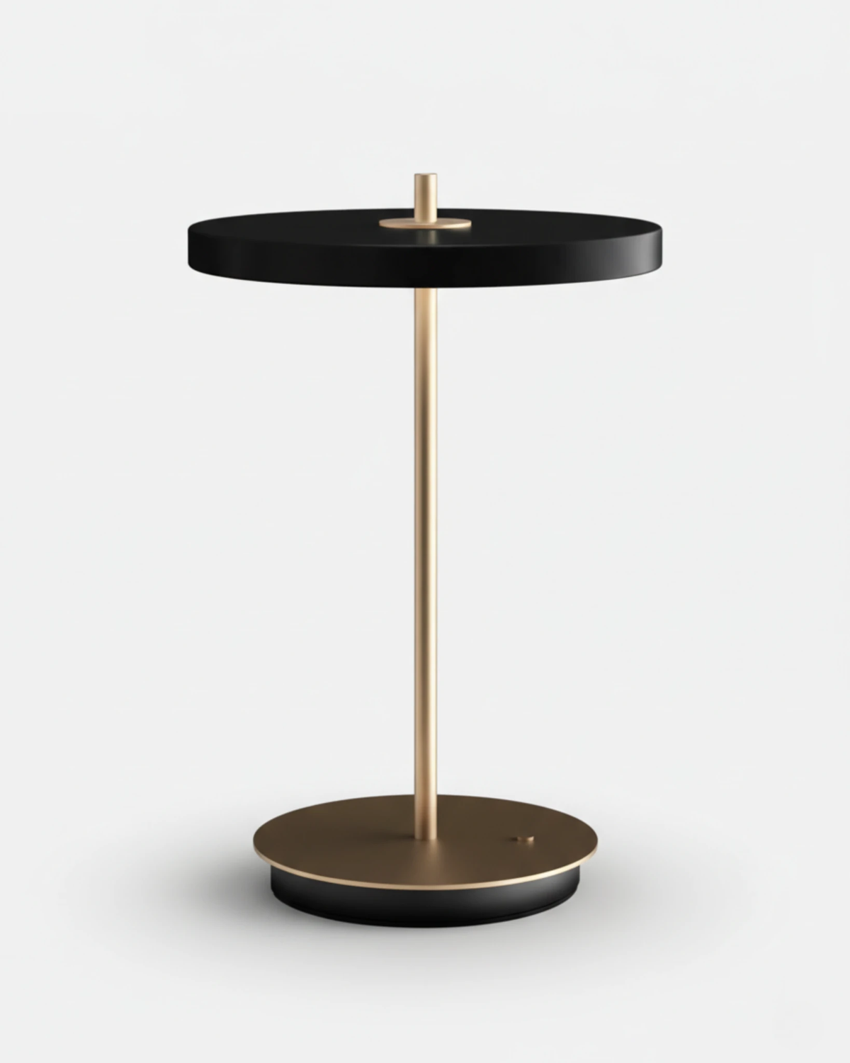 Cordless table lamp SALA No.01 in matte black, flat disc head on a brass stem and round base, unlit