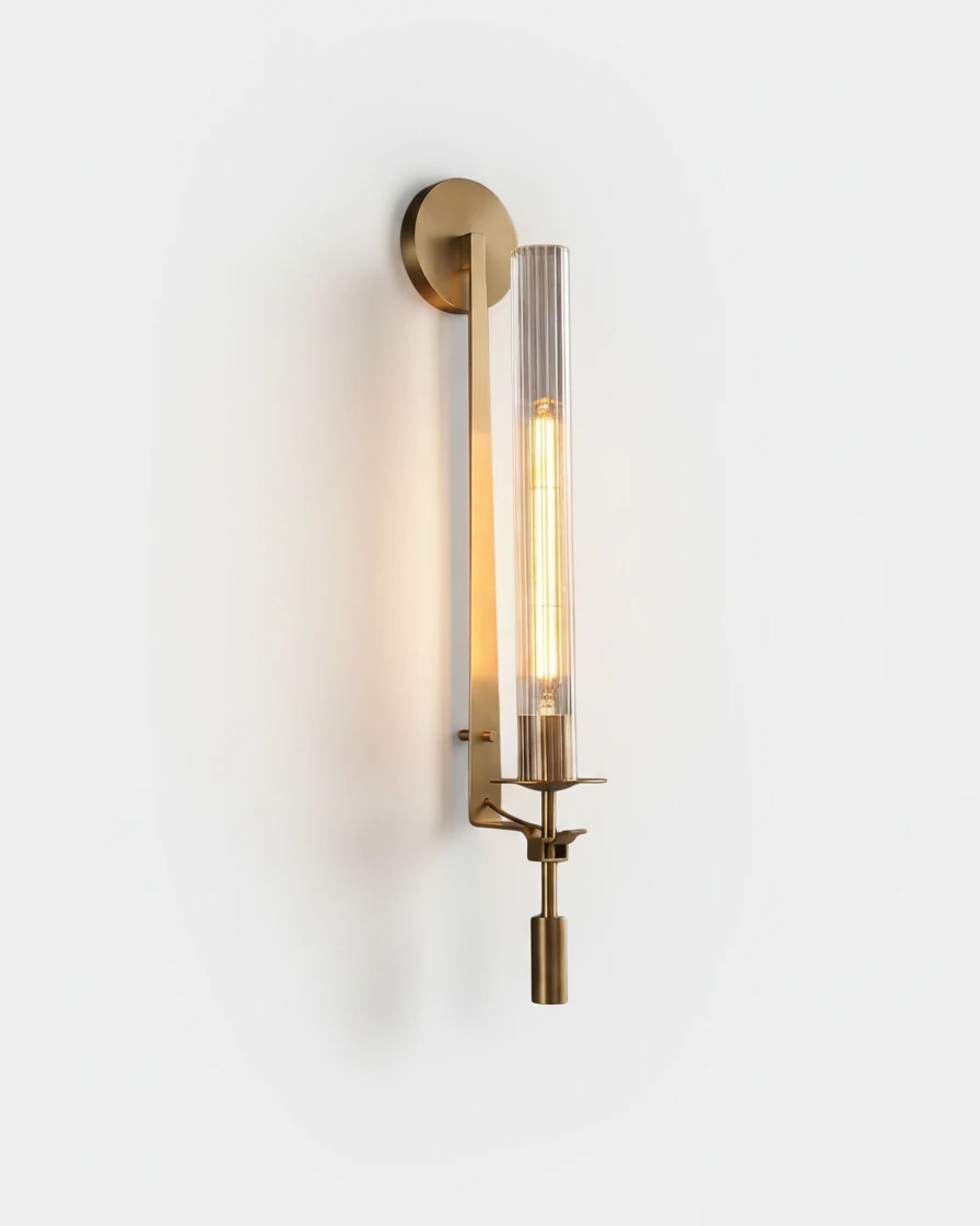 Forged iron wall sconce TORRE No.01 in Elegant Gold, fluted glass tube with a lit filament bulb on a slim gold stem