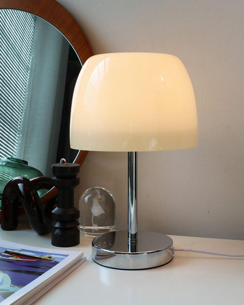 Glass table lamp VENEZIA No.01 with cream shade, unlit, on a wooden sideboard below a round wood-framed mirror