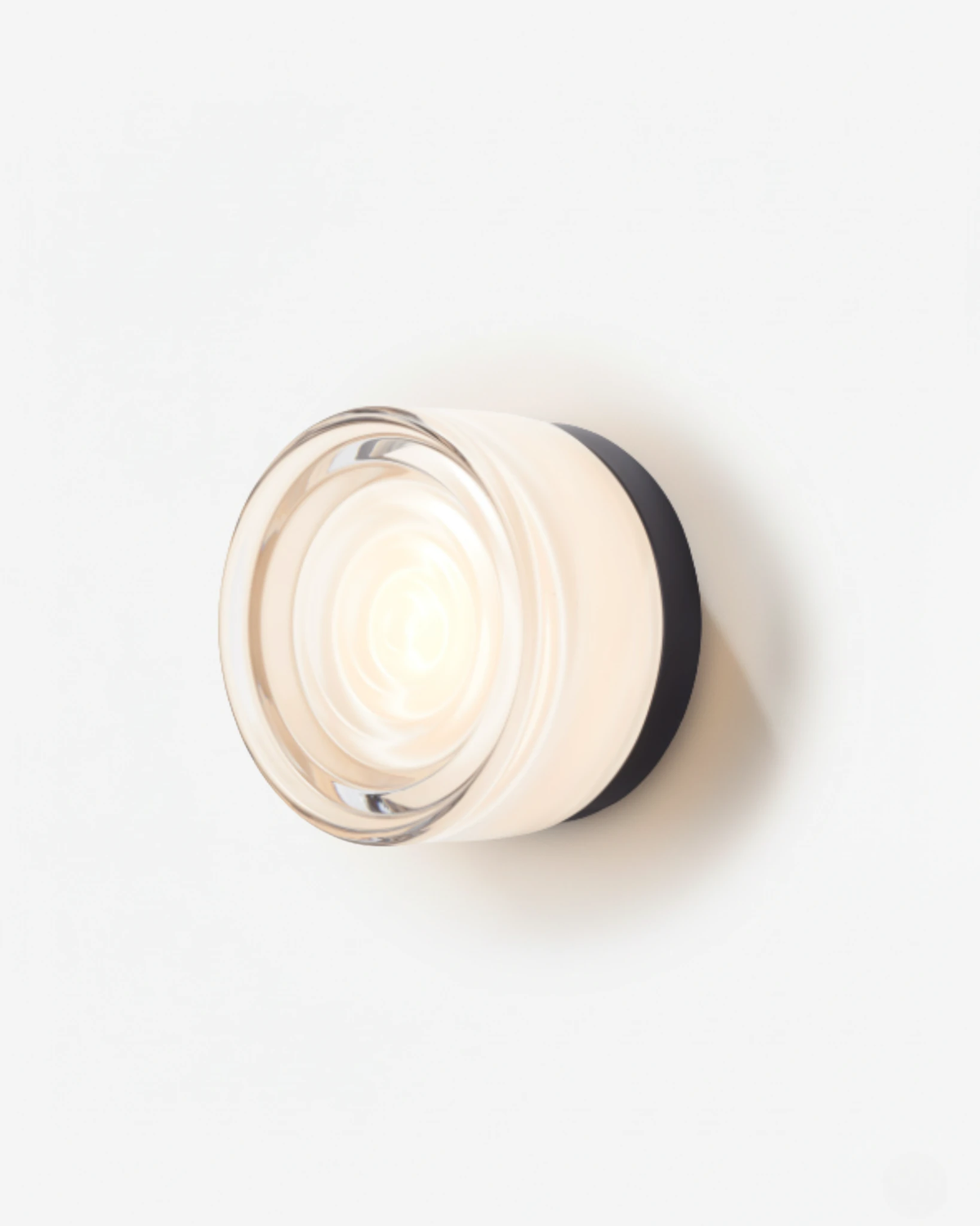 Glass wall sconce HALO No.08 in Opal Echo, clear rippled glass over opal on a black base, lit