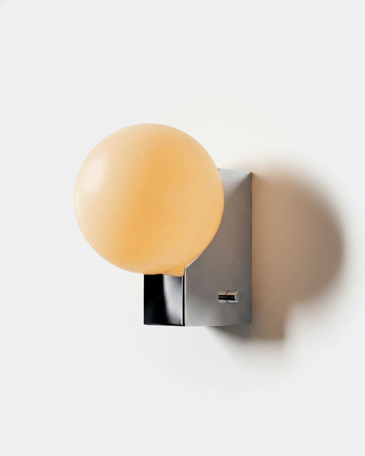 Globe wall sconce ELBA No.01 in chrome, opal glass globe on a polished chrome block with a switch