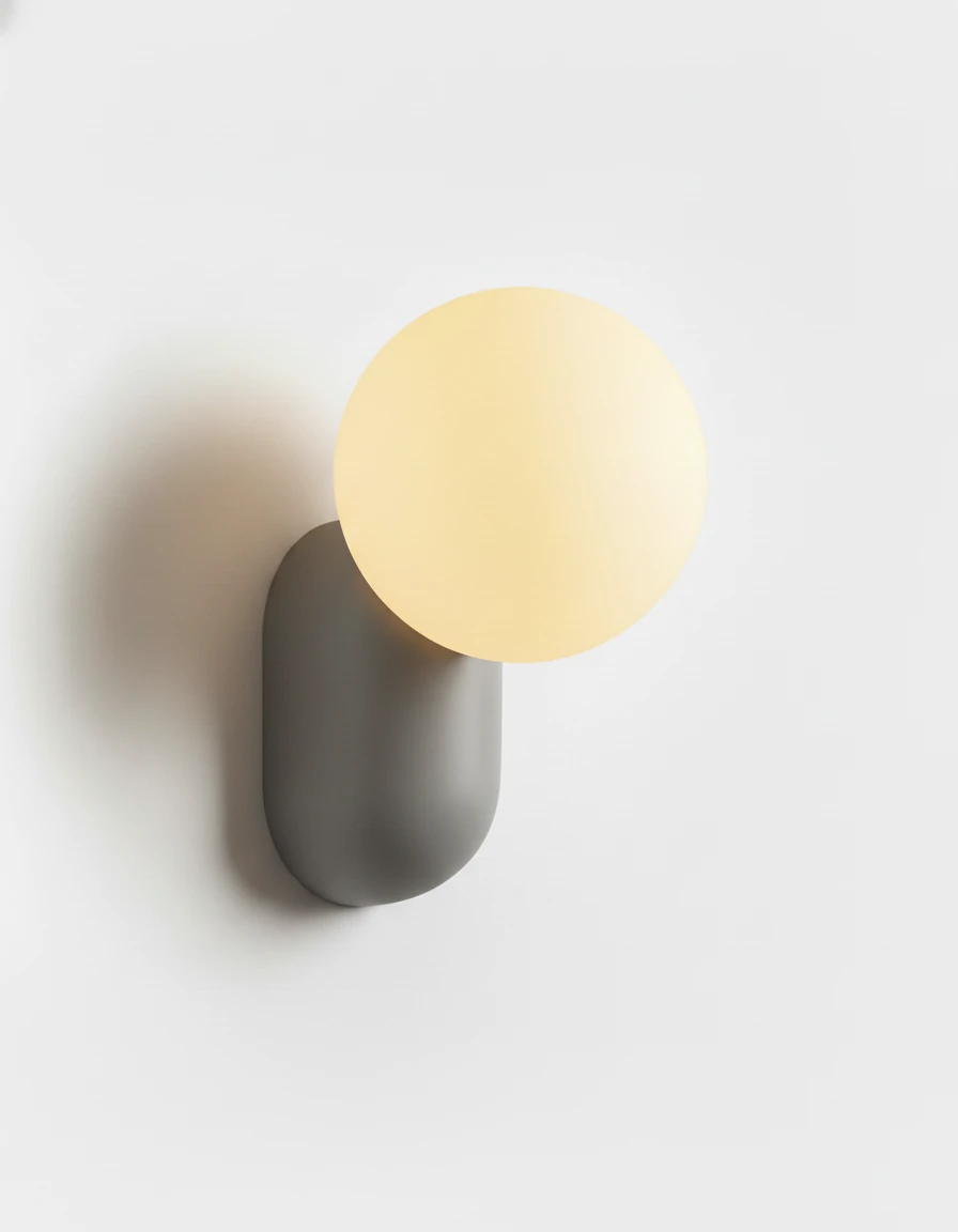 Globe wall sconce AURA No.04 in Stone Gray, gray resin capsule holding a glowing opal globe