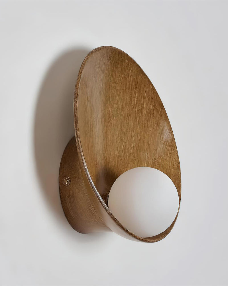 Globe wall sconce OASI No.01 in warm brown, wood-grain shell cradling an opal globe, side view, unlit