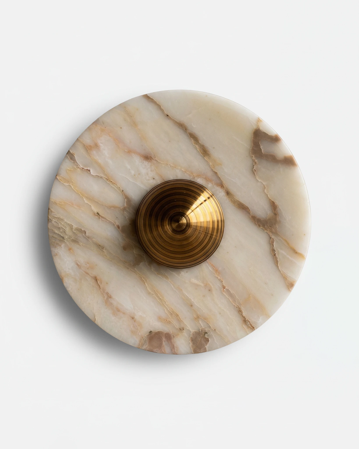 Marble wall sconce LATTE No.01 in Brushed Brass, cream marble disc with gold veining and a ribbed brass center