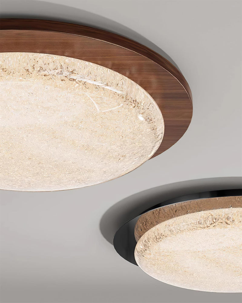 Two modern flush mount ceiling lights NIVE No.01 side by side, one with a walnut ring and one with a black ring, both lit