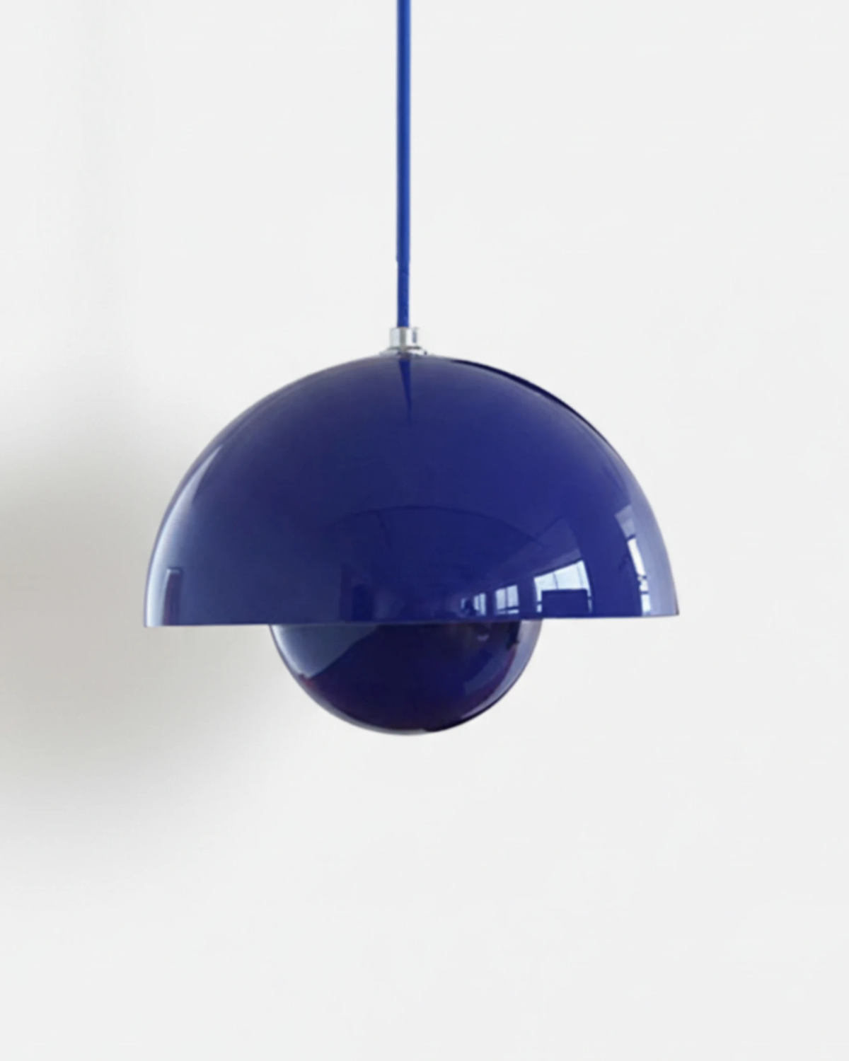 Large 15 in modern pendant light ALTO No.01 in cobalt blue lacquer with a blue cord on a white background