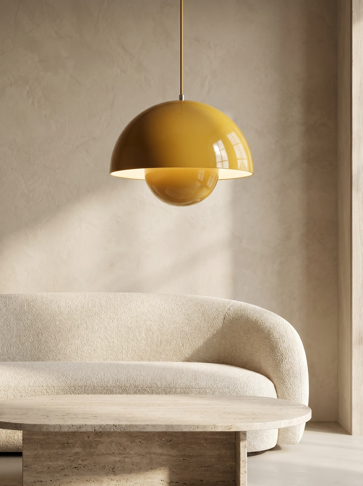 Modern pendant light ALTO No.01 in mustard yellow hanging above a curved beige sofa in a living room