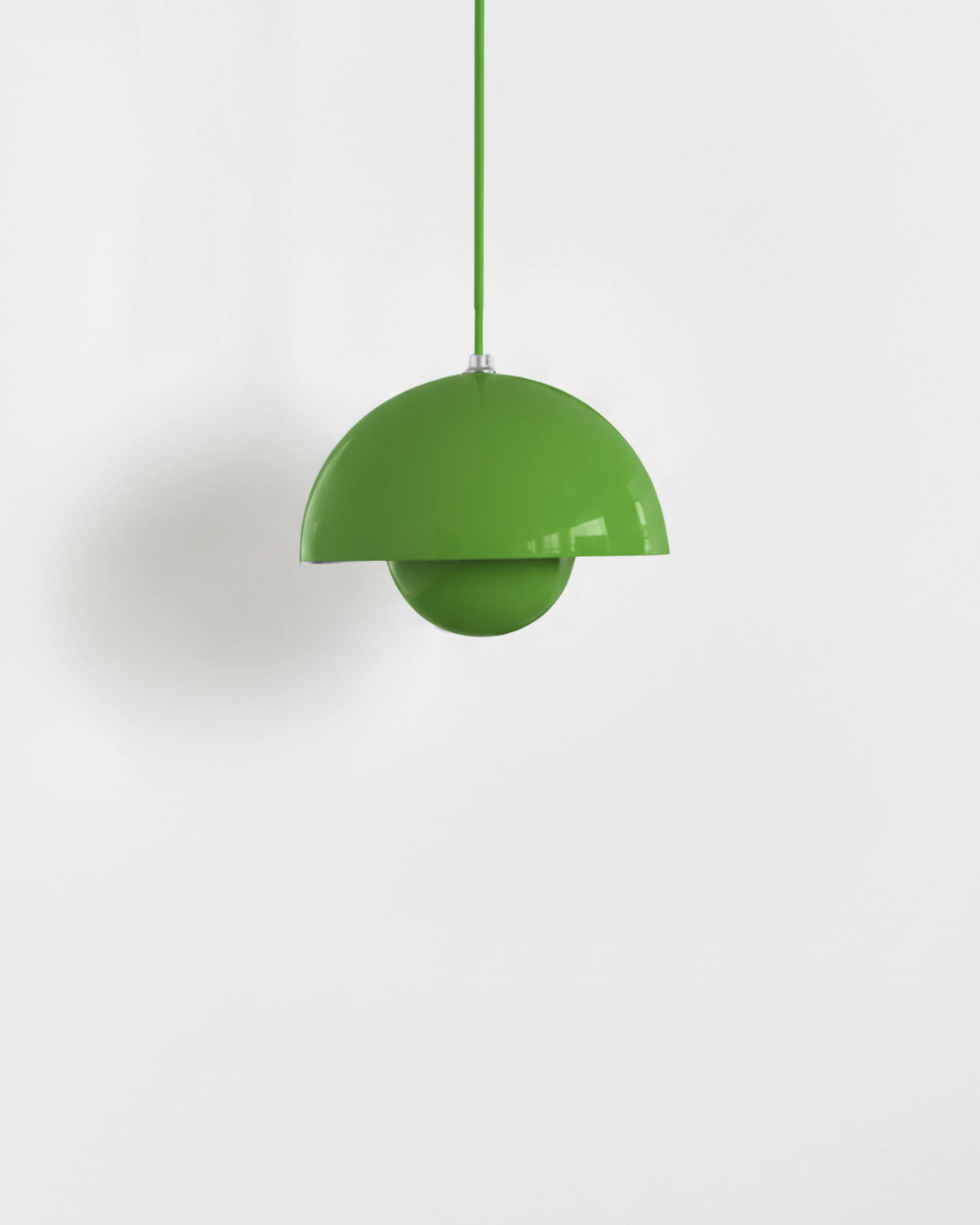Small 6 in modern pendant light ALTO No.01 in signal green lacquer with a green cord, unlit packshot