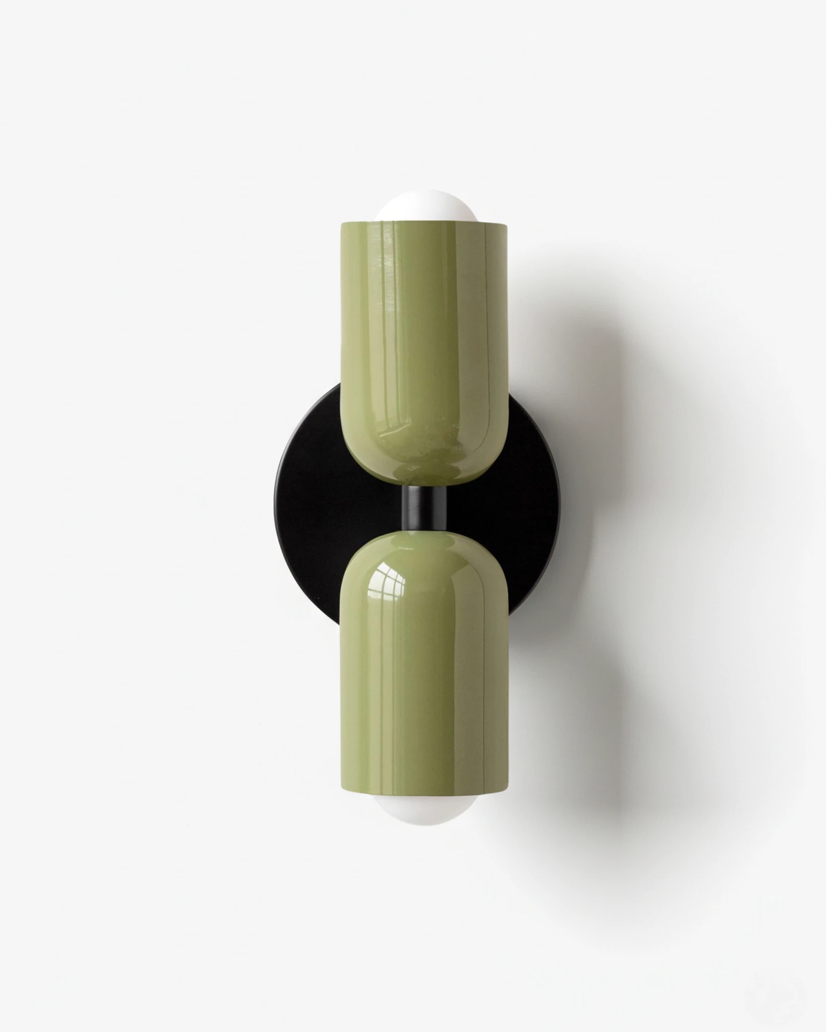 Modern wall sconce TORINO No.01 in Green & Green, two olive green capsule shades with white end caps, unlit