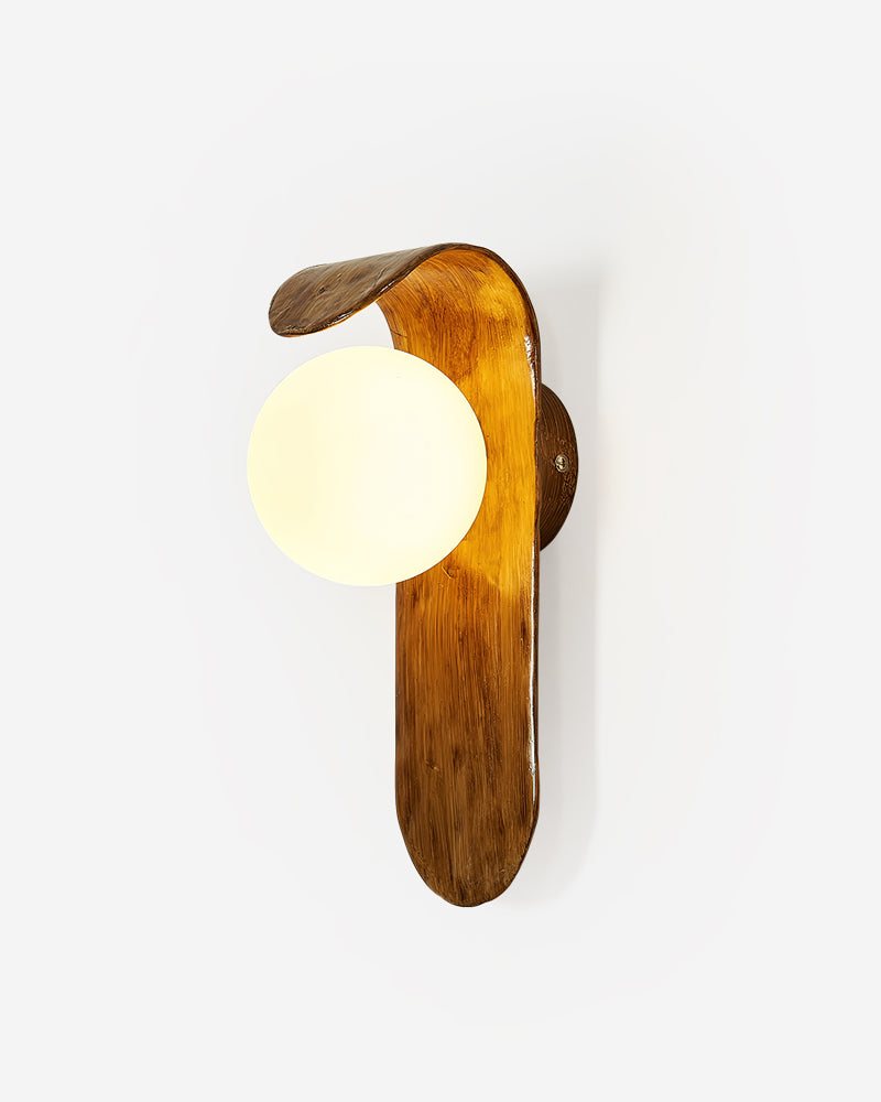 Modern wall sconce ANIMA No.02, sculpted walnut-tone polymer body with an opal globe switched on