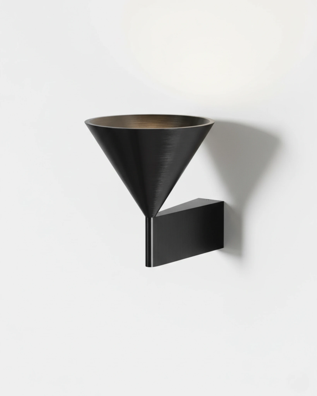 Modern wall sconce ETNA No.01 in matte black, cone uplight on a flat wall bracket, white background