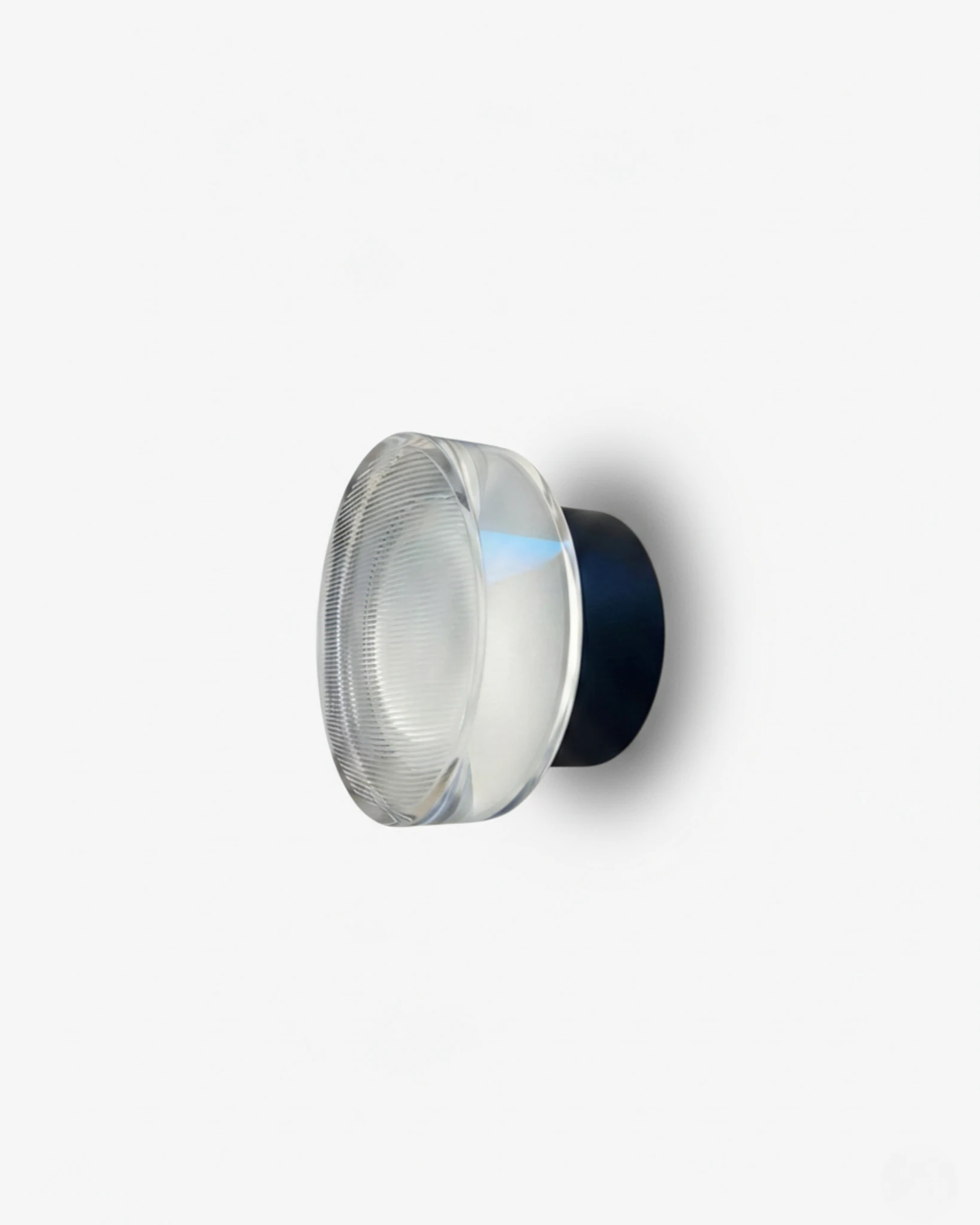 Modern wall sconce OBLI No.01 in Matte Black, clear fluted acrylic disc mounted on a black cylinder