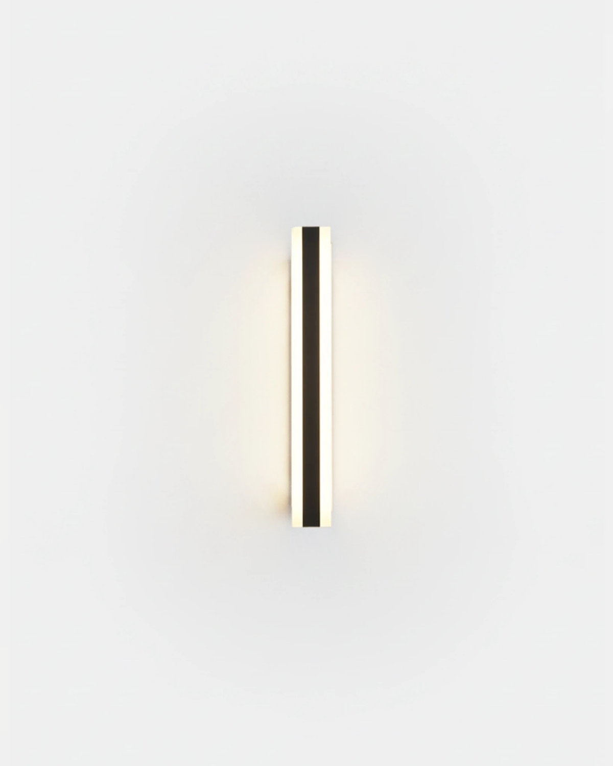 Outdoor wall sconce GIARDINO No.01, 60 cm black aluminum column glowing on a plain white wall