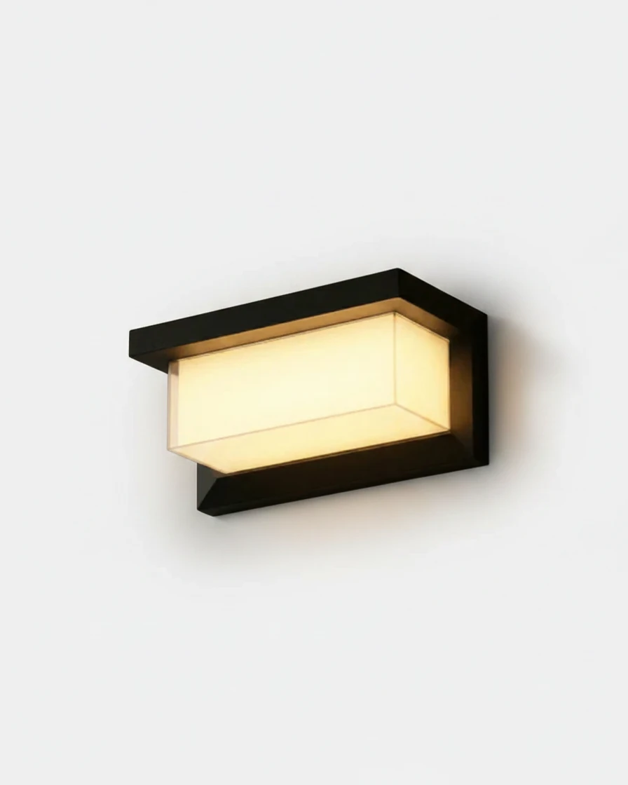 Outdoor wall sconce BRISA No.01 compact 10 in, black aluminum frame with a glowing acrylic block