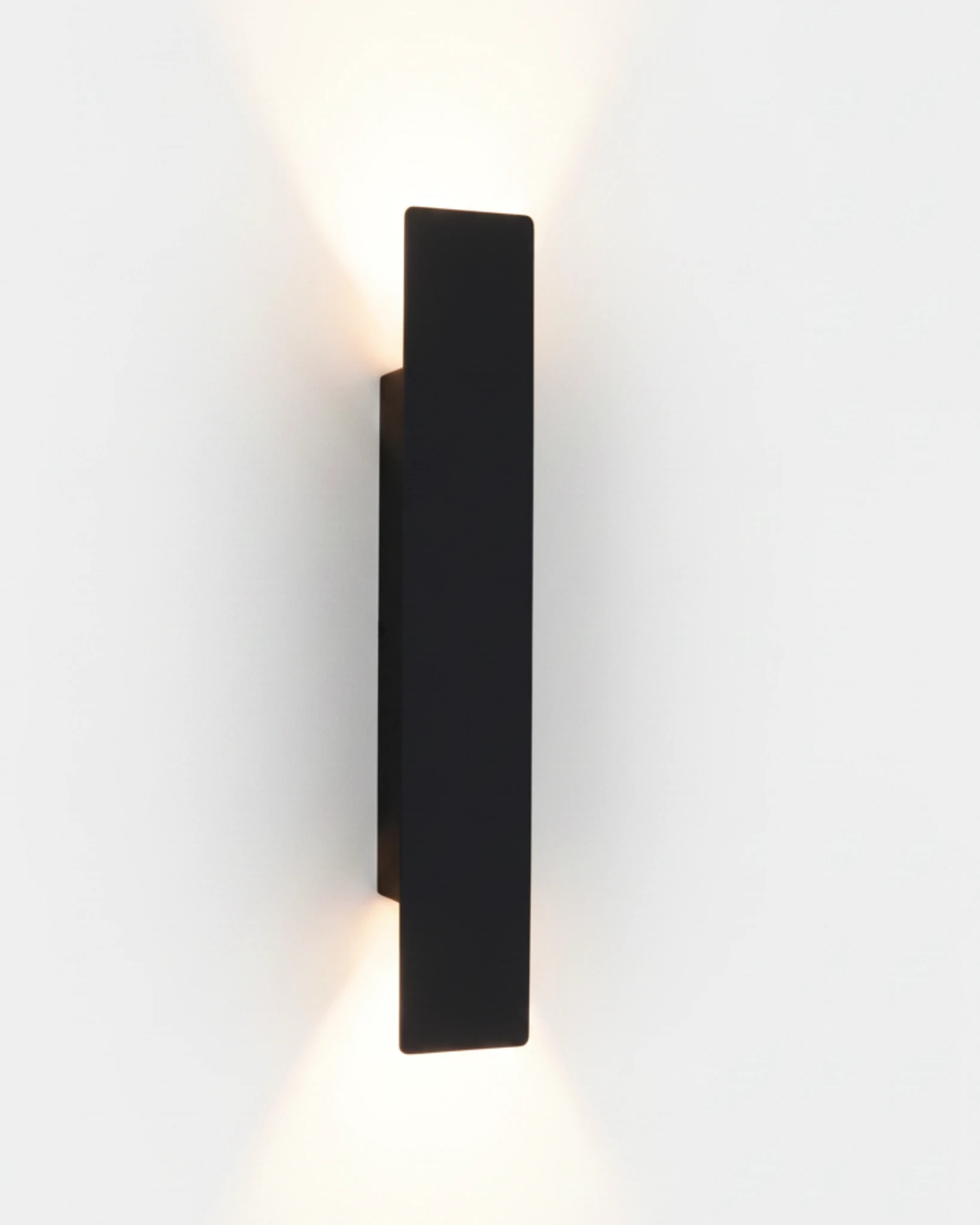 Outdoor wall sconce COLLE No.01, matte black Large 24 in bar lit, casting light up and down the wall