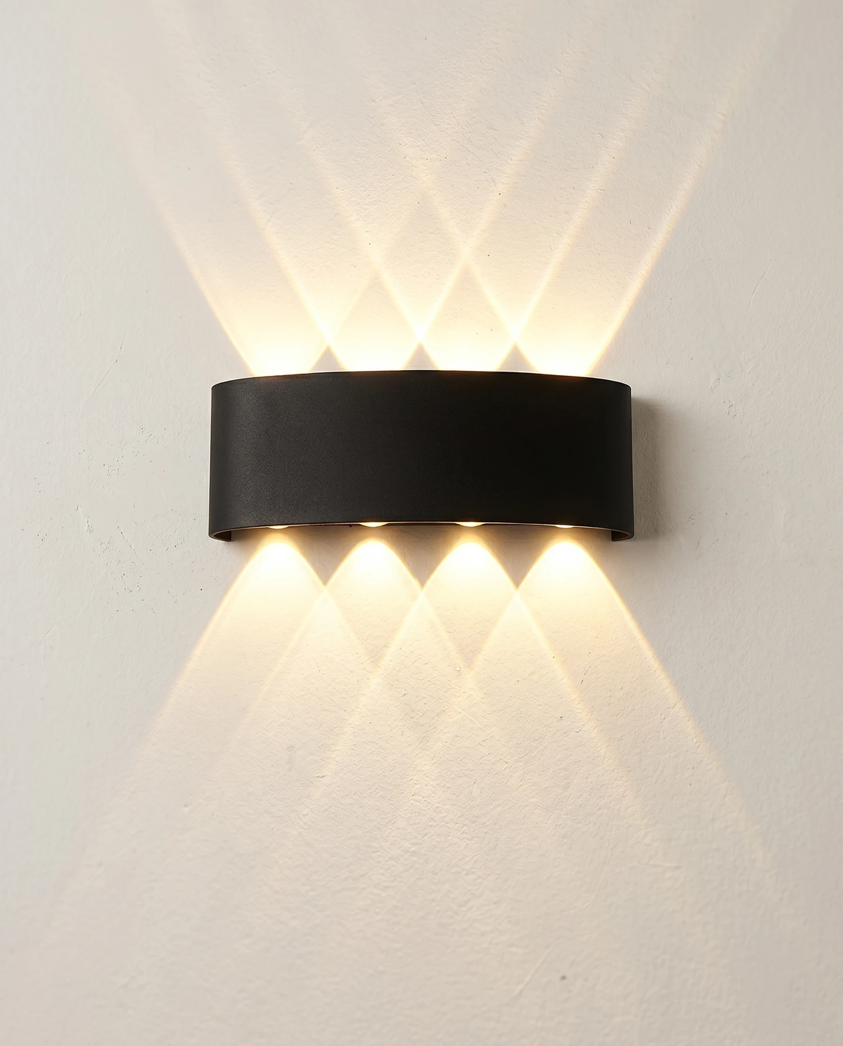 Outdoor wall sconce PALAZZO No.01 in matte black, 8W size with four beams up and four down, switched on