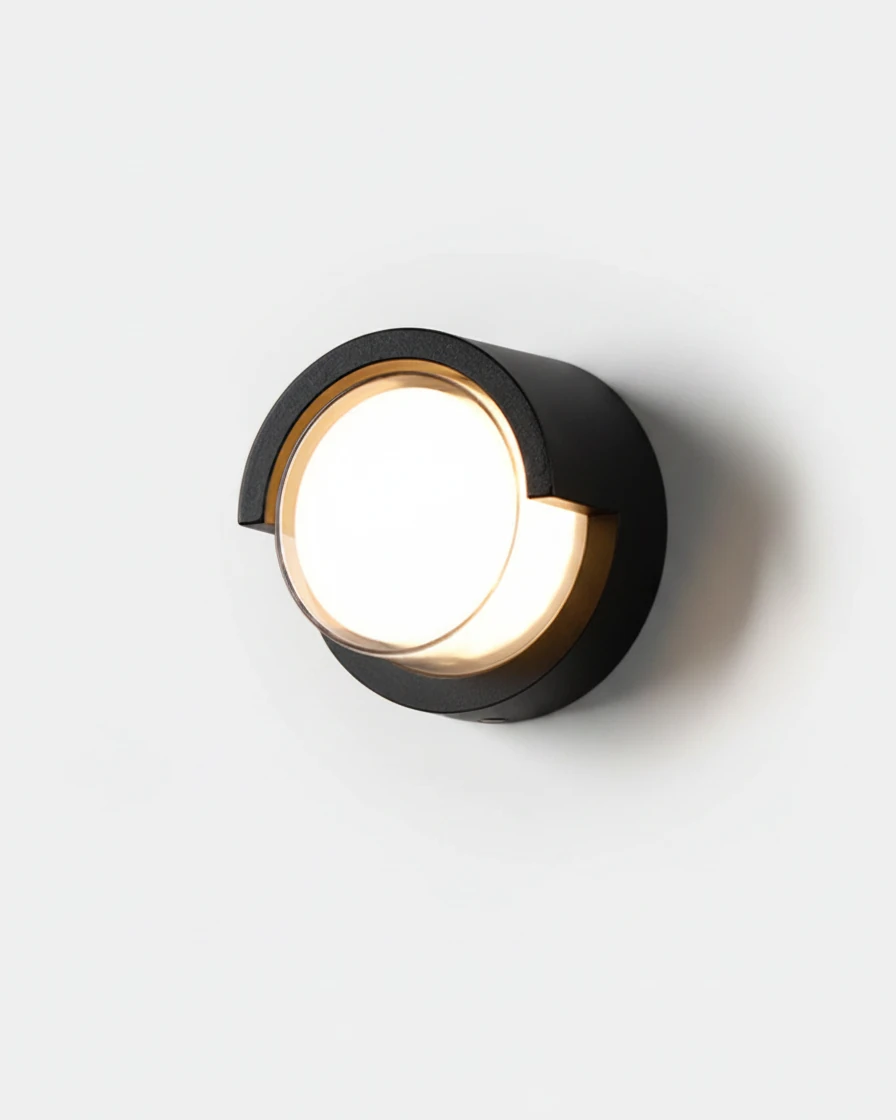 Outdoor wall sconce NOTO No.02, round black aluminum porthole with a hooded top and lit opal lens
