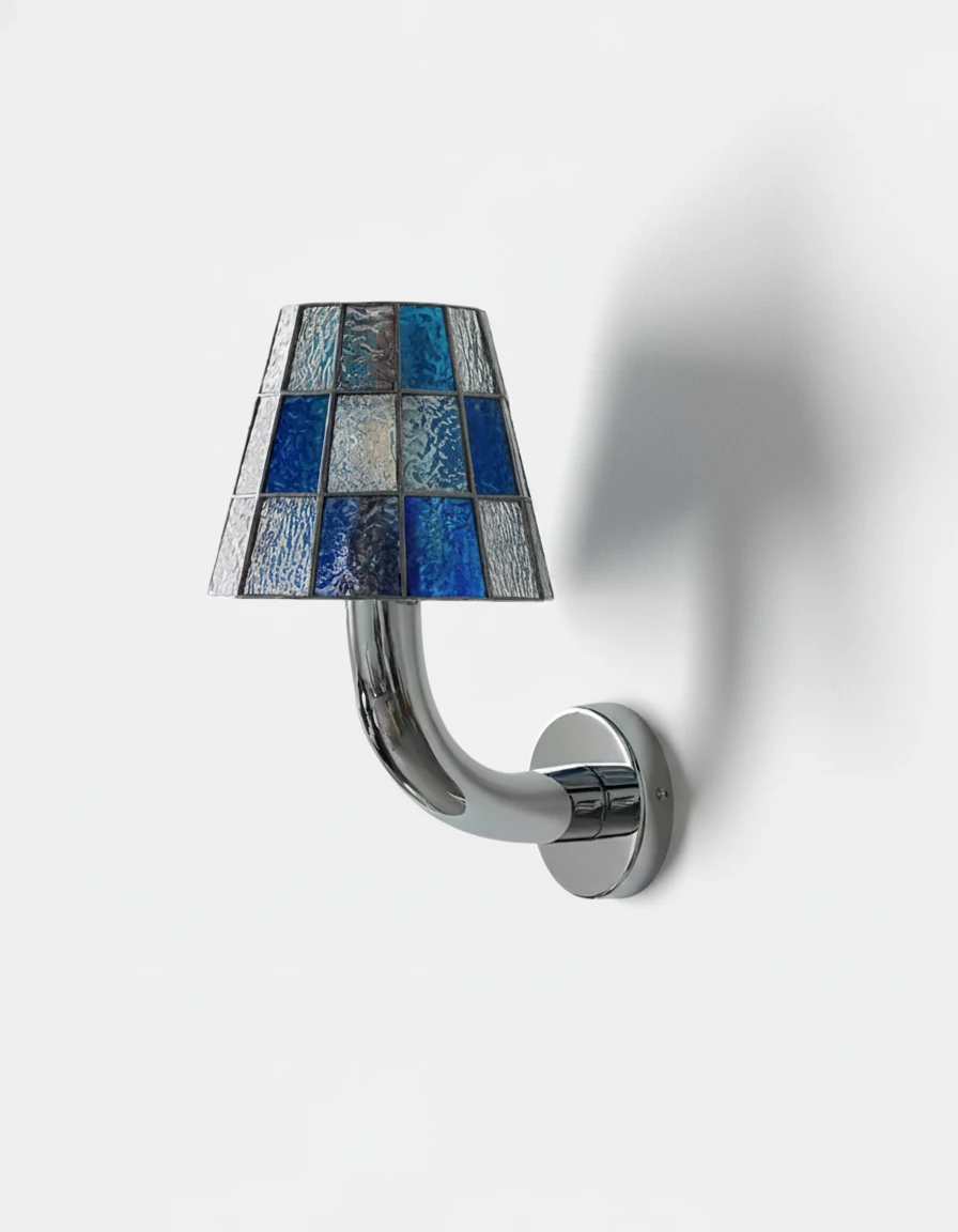 Stained glass wall sconce TESSERA No.01 in Aegean Blue, mosaic of blue and clear panes on a polished chrome arm
