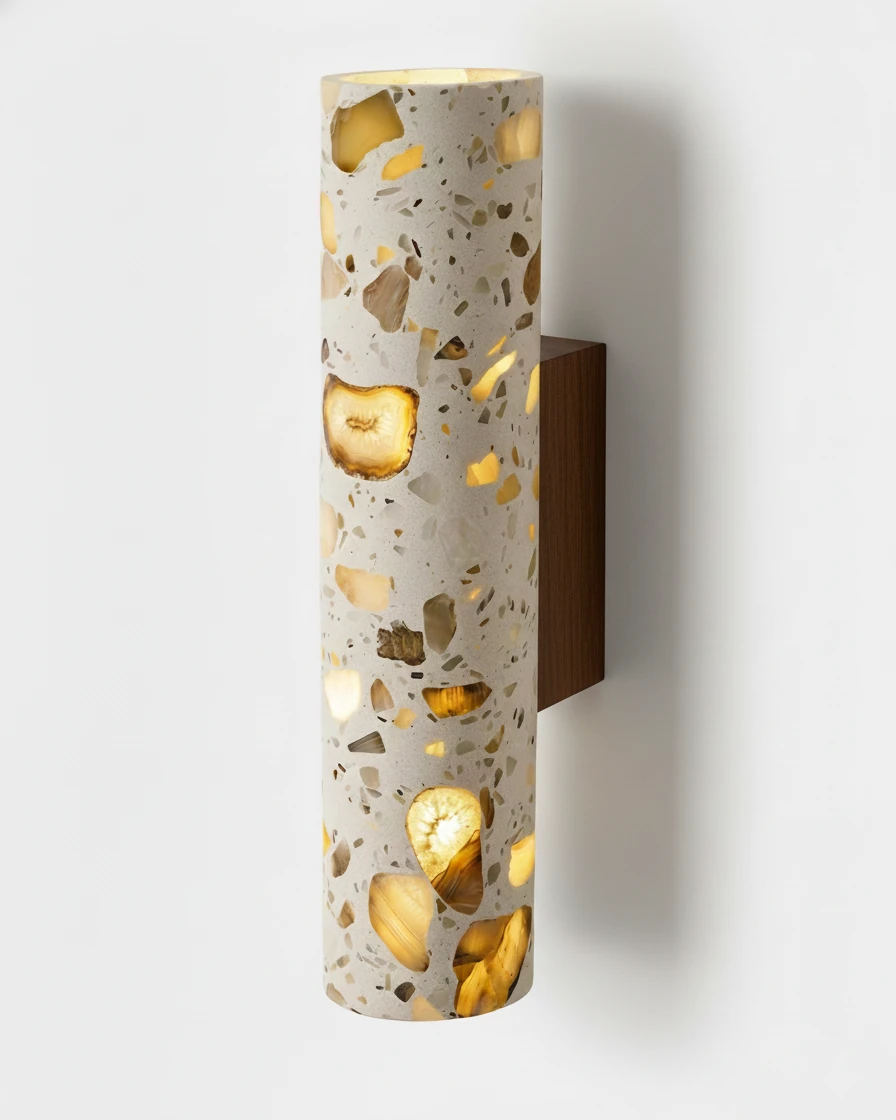 Terrazzo wall sconce INCA No.02 tall size, beige terrazzo cylinder on a walnut block with the chips glowing