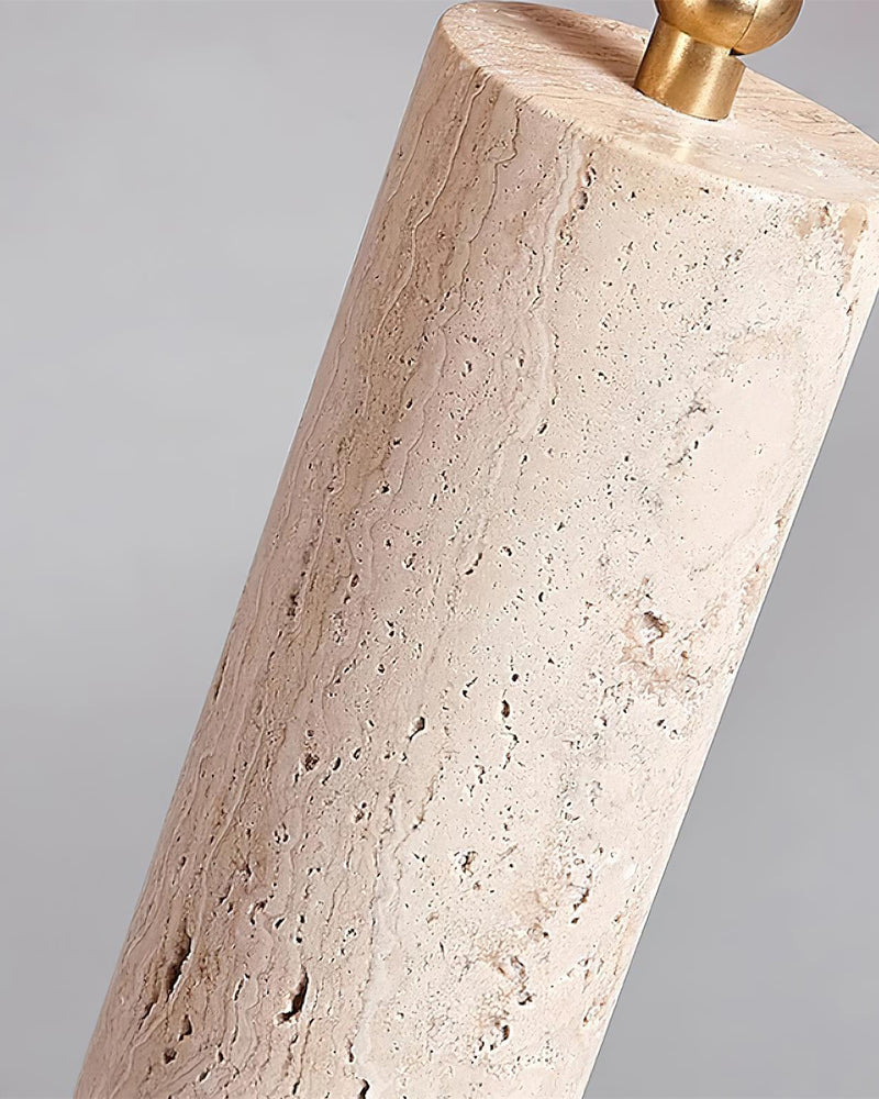 Close-up of one travertine cylinder spot with brass pivot on the PIETRA No.04 travertine flush mount ceiling light