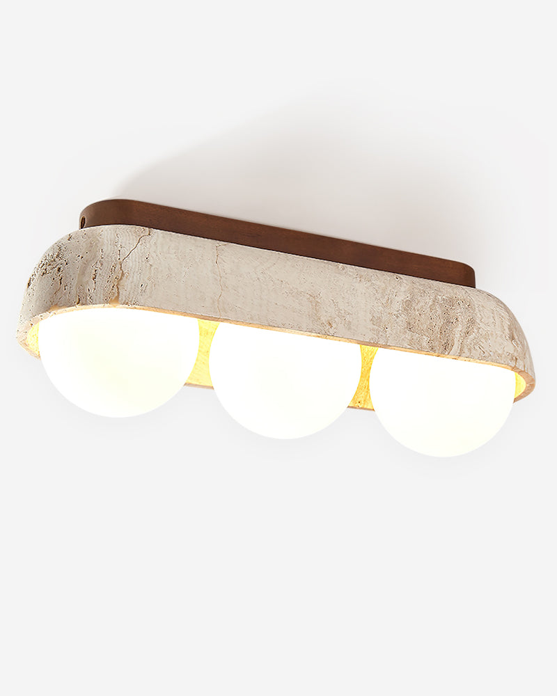 Travertine flush mount ceiling light PIETRA No.03 Three-Globe in Walnut, three opal globes switched on under a stone bar