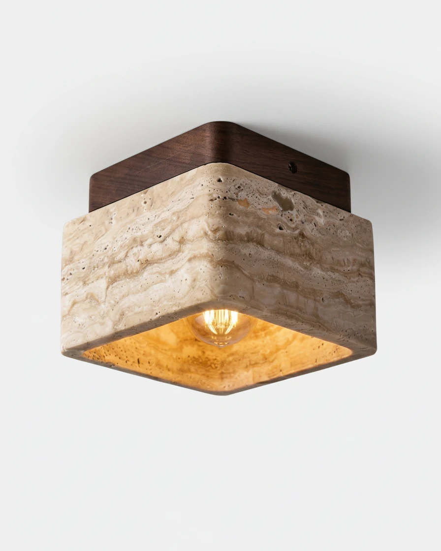 Travertine flush mount ceiling light CARSO No.01 with a walnut brown canopy, travertine block lit from inside