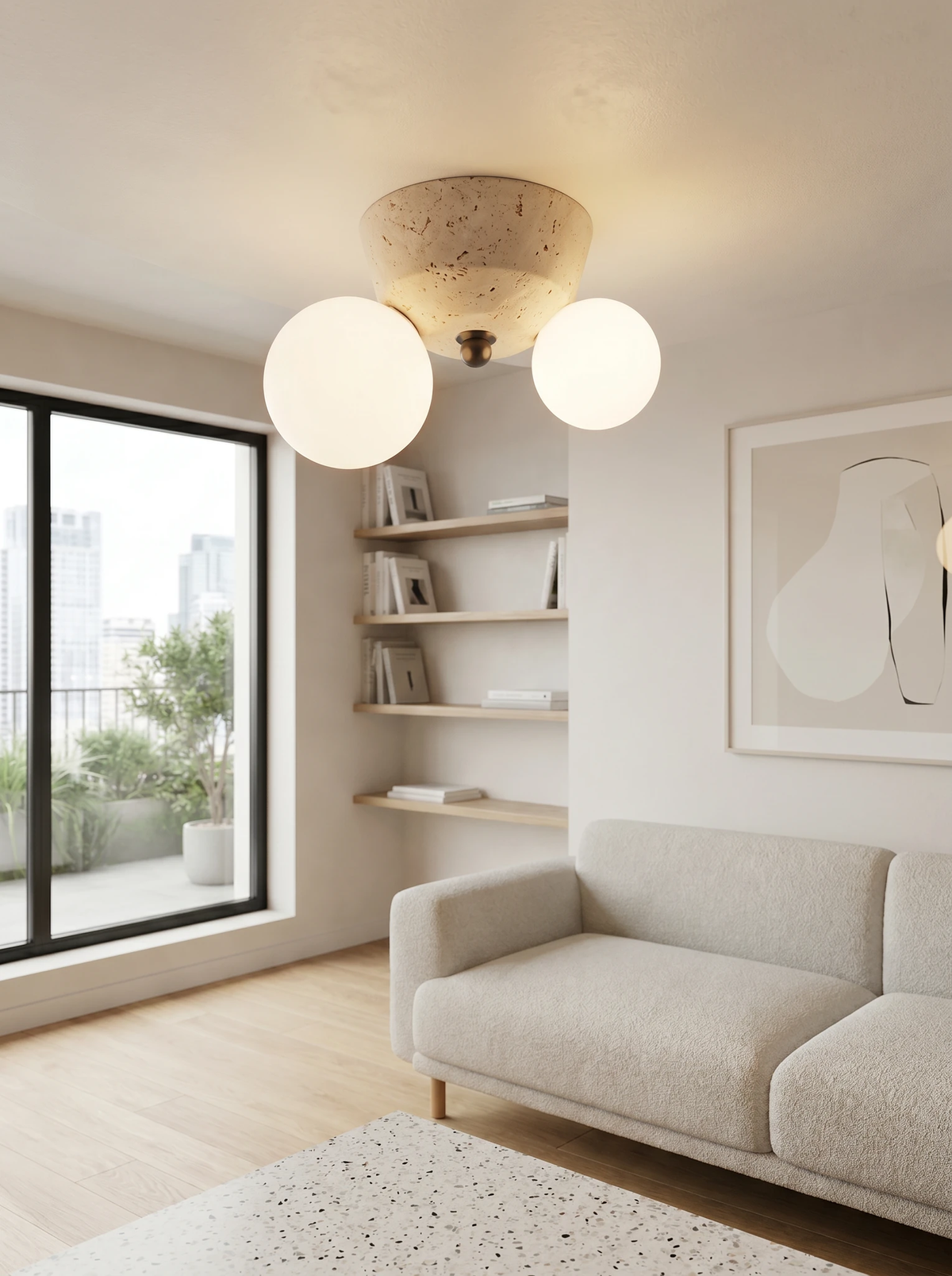 Travertine flush mount ceiling light AVORIO No.01, twin globes lit on the ceiling of a living room with a gray sofa