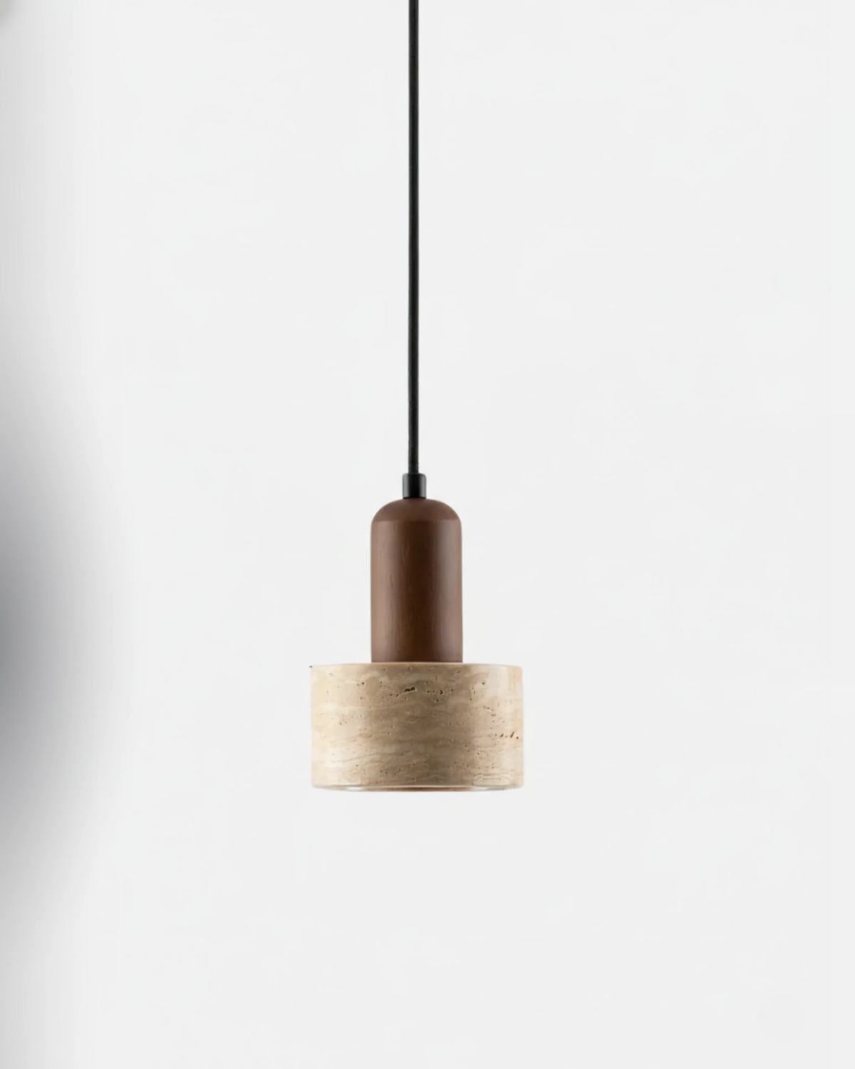 Travertine pendant light TONDO No.05, mini cream travertine drum under a walnut cap on a black cord, unlit