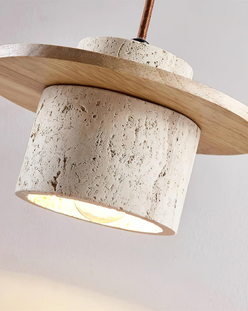 Close-up from below of the travertine pendant light TONDO No.03 with the lit drum and natural wood disc