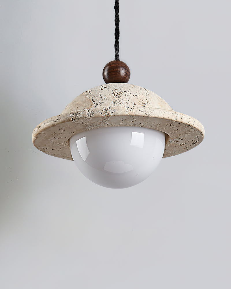 Close-up of the pitted travertine saucer, walnut ball and opal globe of the SOVA No.01 pendant light