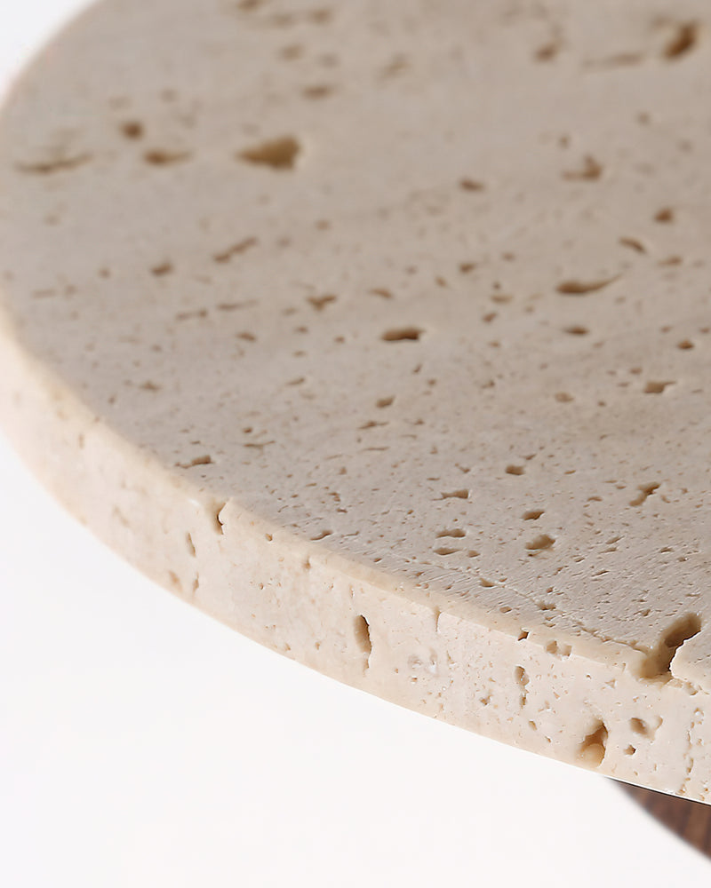 Close-up of the pitted cream travertine top surface of the SOVA No.02 travertine pendant light