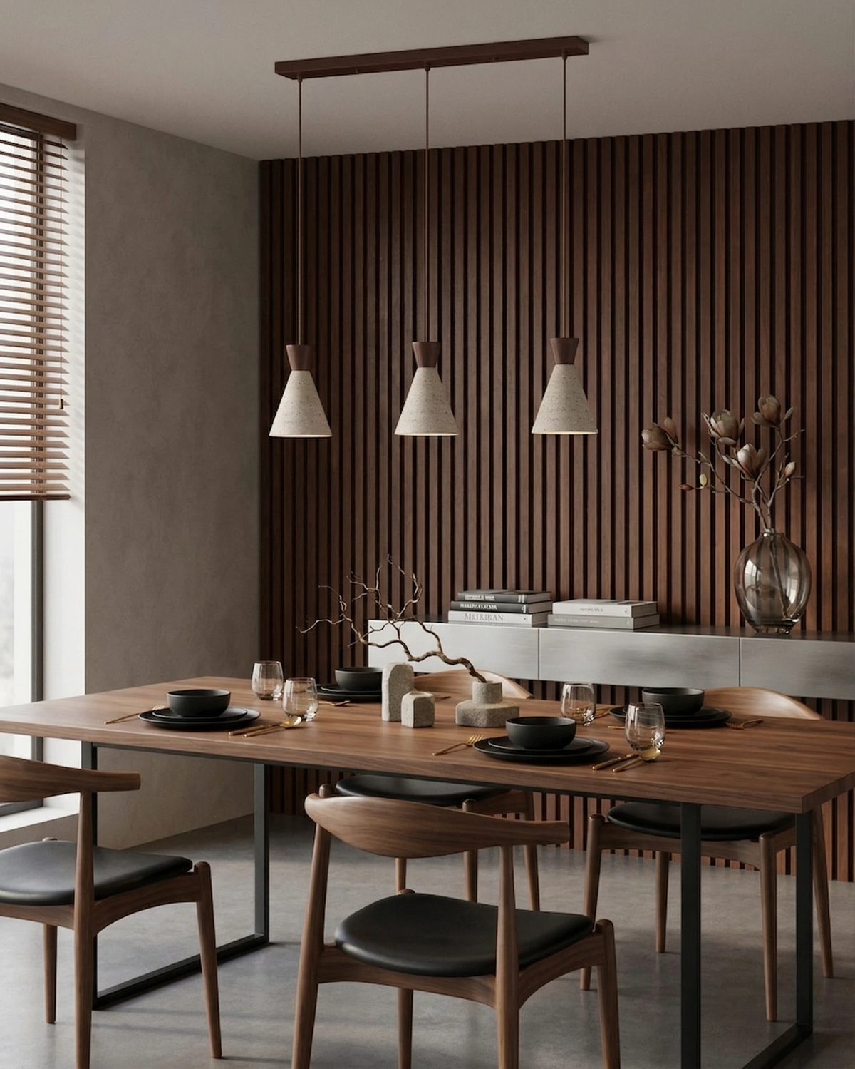 Travertine pendant light CONA No.02, three cone pendants lit over a walnut dining table against a wood slat wall