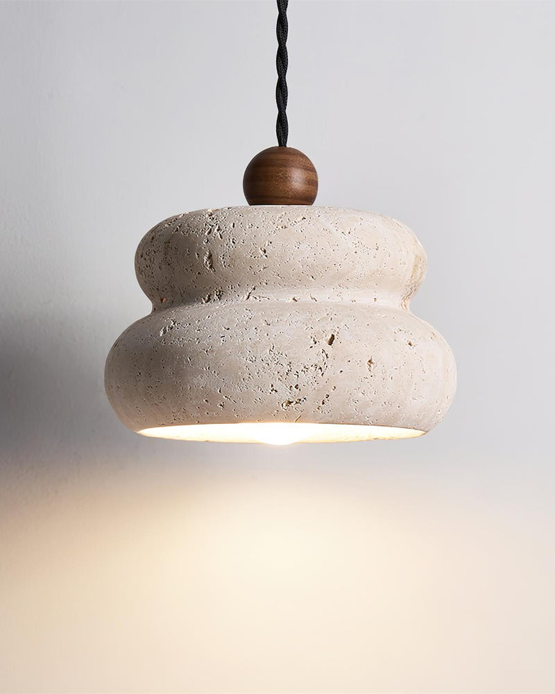 Travertine pendant light SOVA No.05 solo, pitted cream stone pebble shade with walnut bead switched on