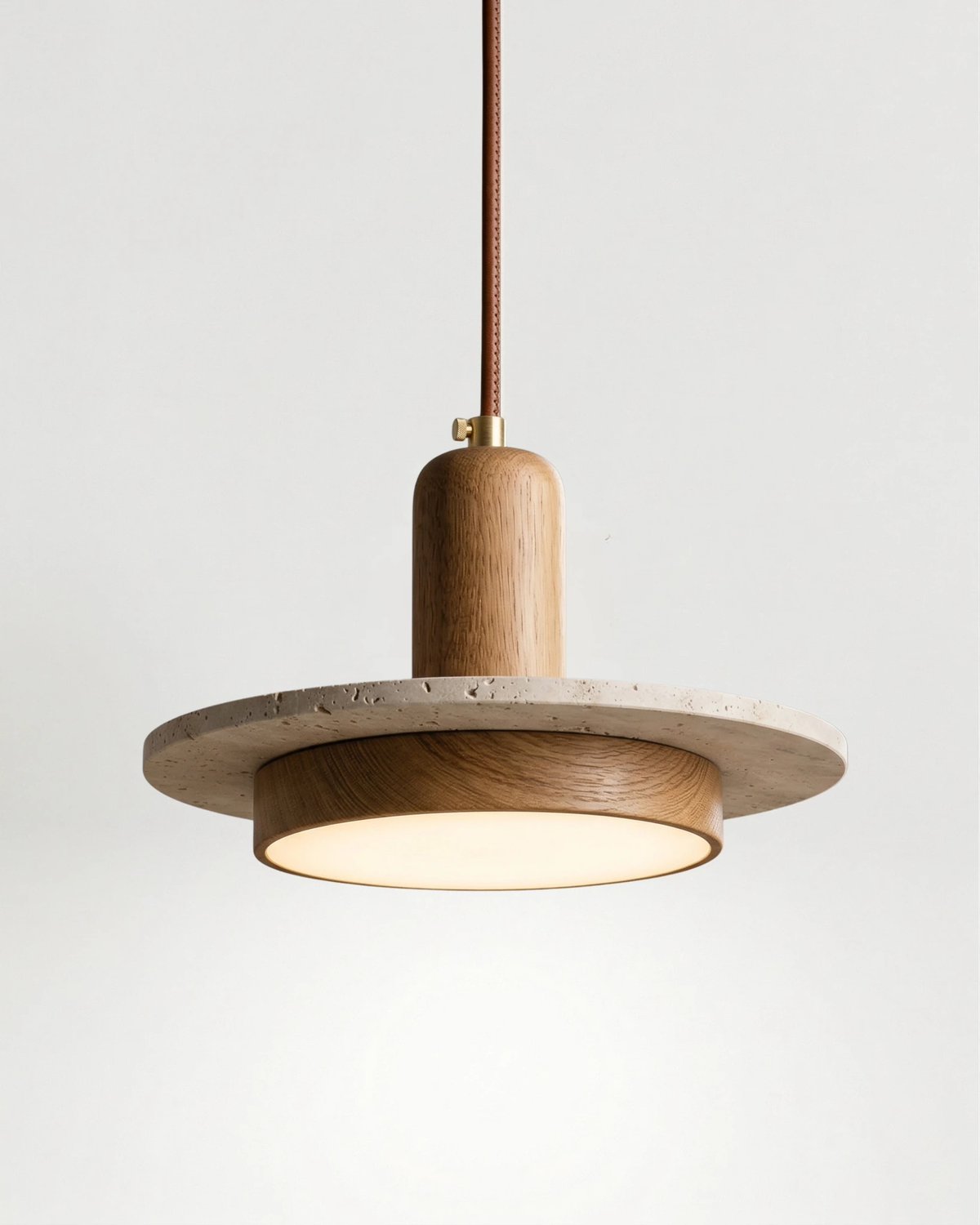 Travertine pendant light SOVA No.02 Single in Light Oak, travertine saturn disc with an oak cylinder, switched on