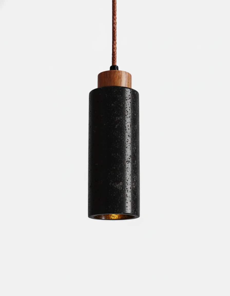 Travertine pendant light CORTO No.03 solo in Volcano Black, textured dark cylinder with walnut top, lit at the base