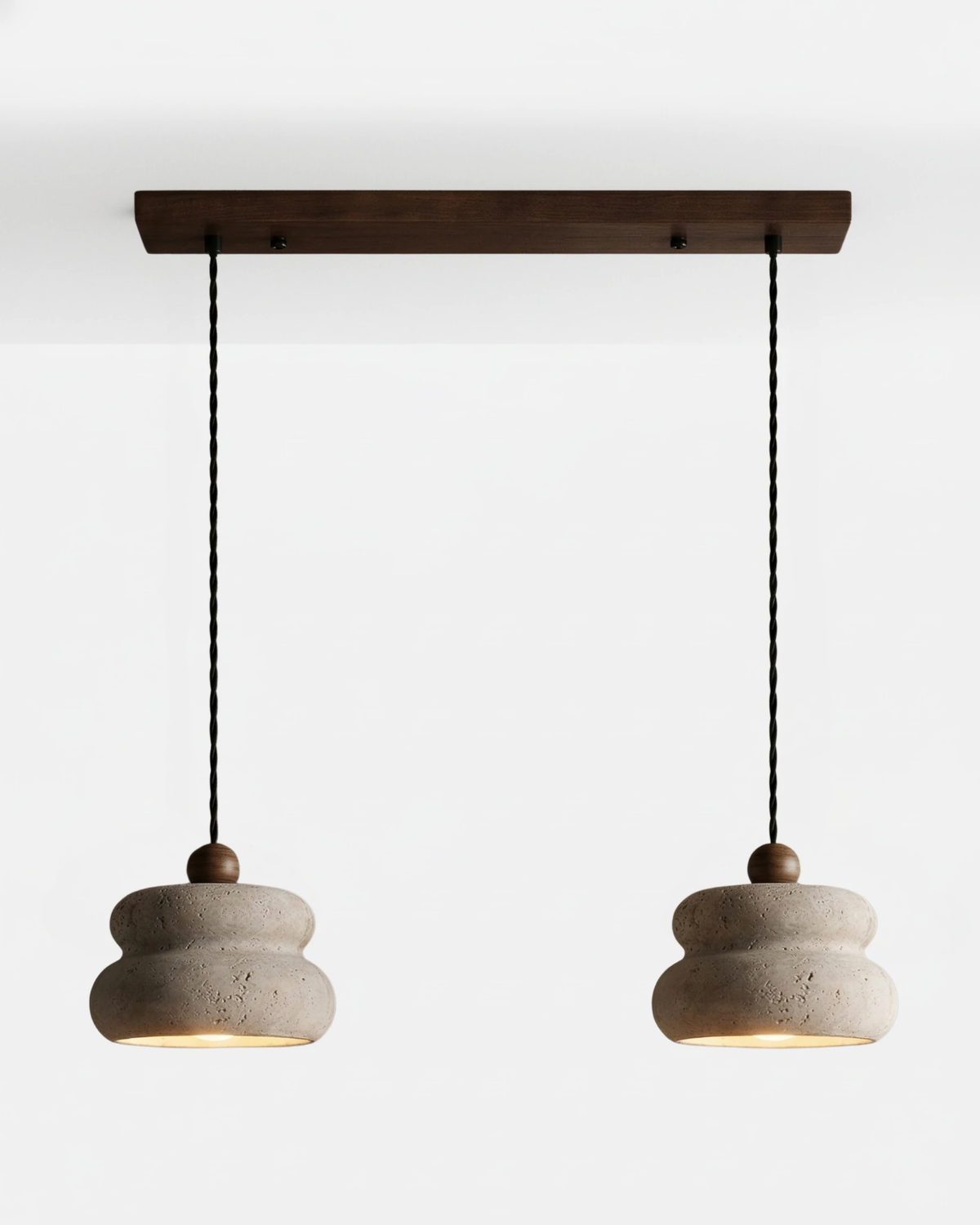 Travertine pendant light SOVA No.05 Double Cluster, two cream stone pendants on a walnut ceiling bar, lit