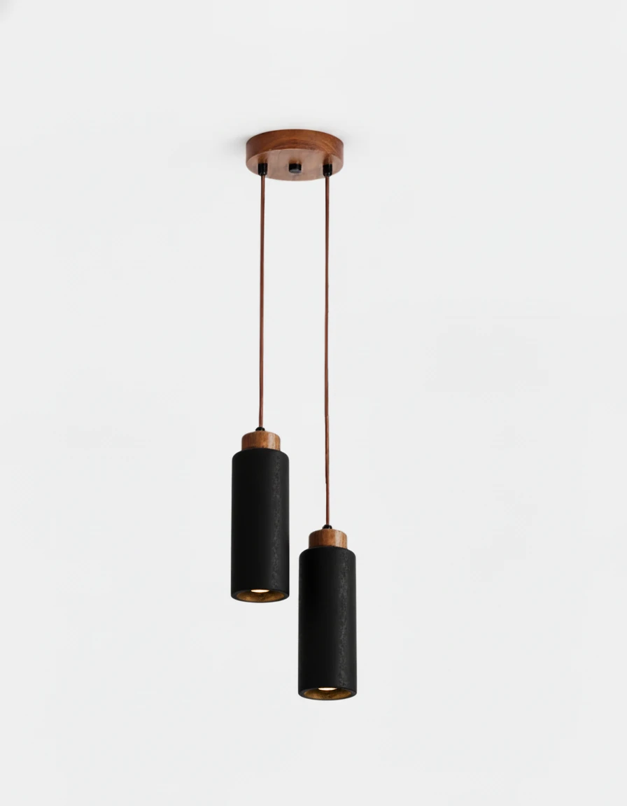 Travertine pendant light CORTO No.03 double in Volcano Black, two dark cylinders on a small walnut canopy, lit
